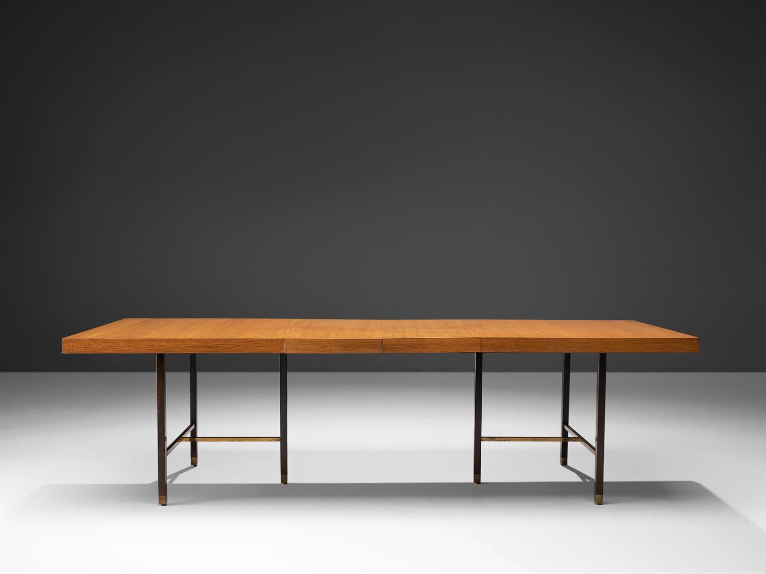 Harvey Probber Inc., mahogany and stained mahogany for the legs, brass, USA, circa 1955.

This Minimalist, modest table is designed by Harvey Probber. The top, executed in warm mahogany forms a striking balance with the dark stained legs and the