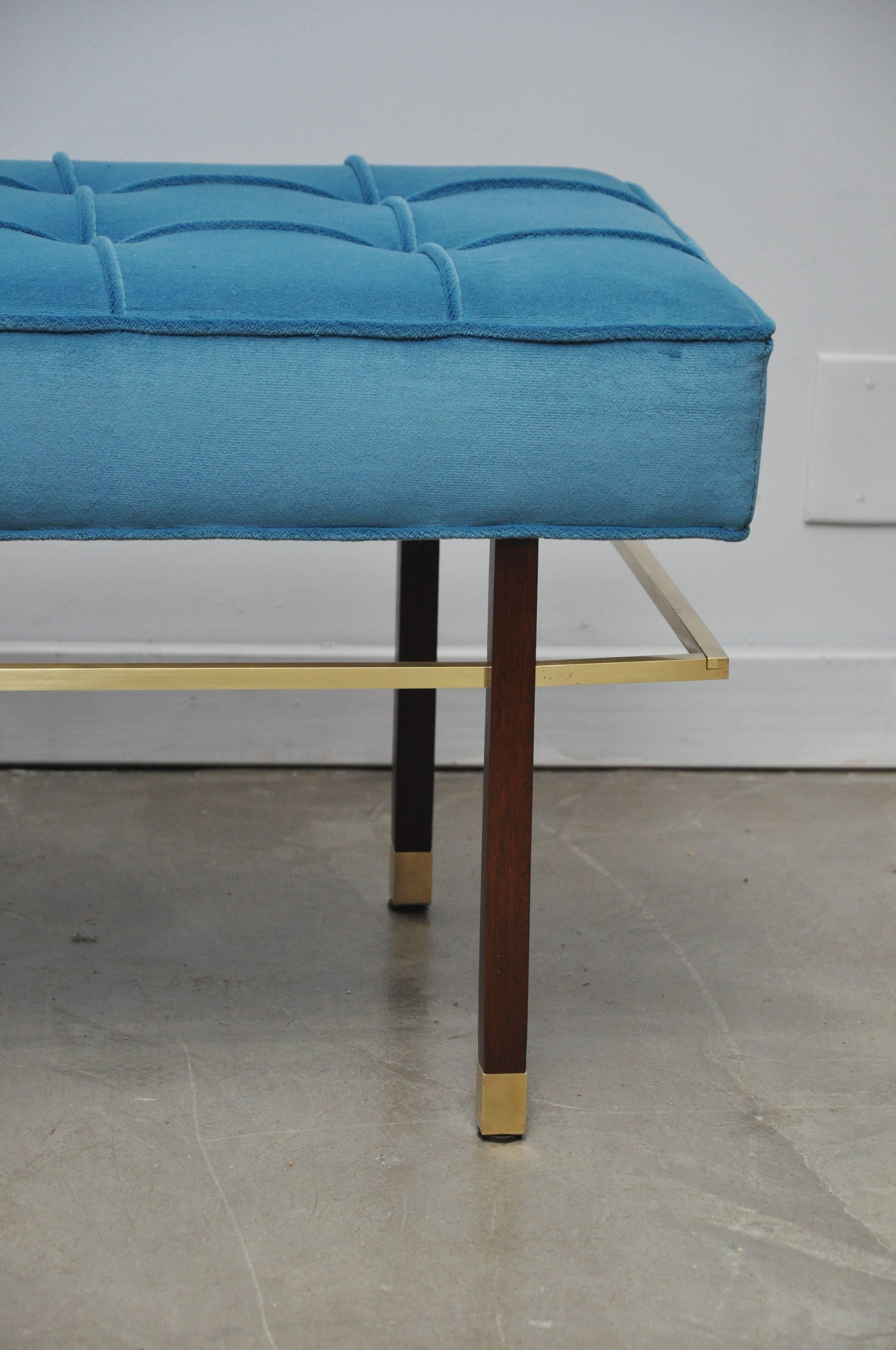 Beautiful walnut frame bench with brass stretchers by Harvey Probber. Fully restored and reupholstered in blue velvet.