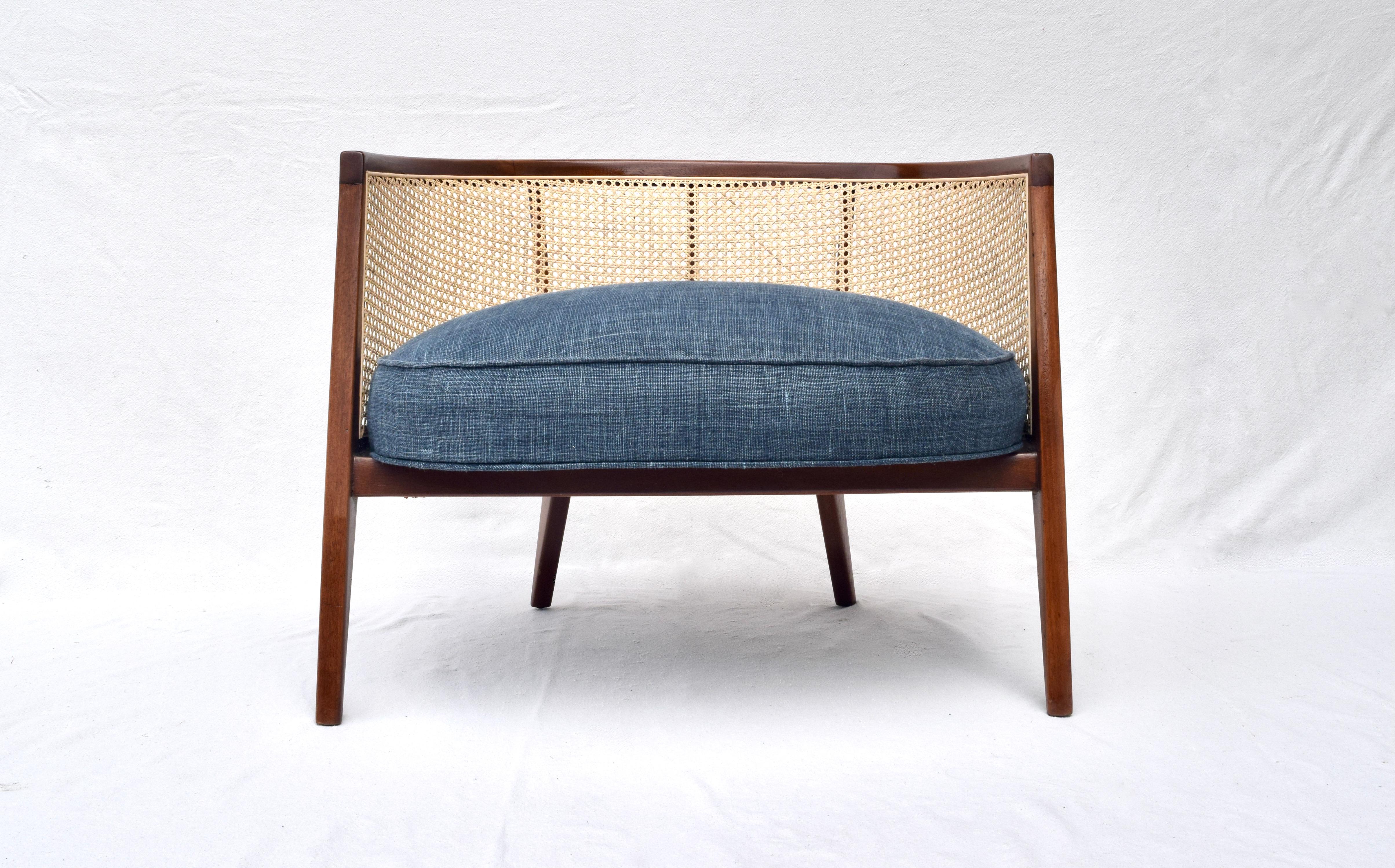 Fully restored mahogany and cane lounge chair designed by Harvey Probber upholstered in deep blue Indigo Belgian Linen.
  