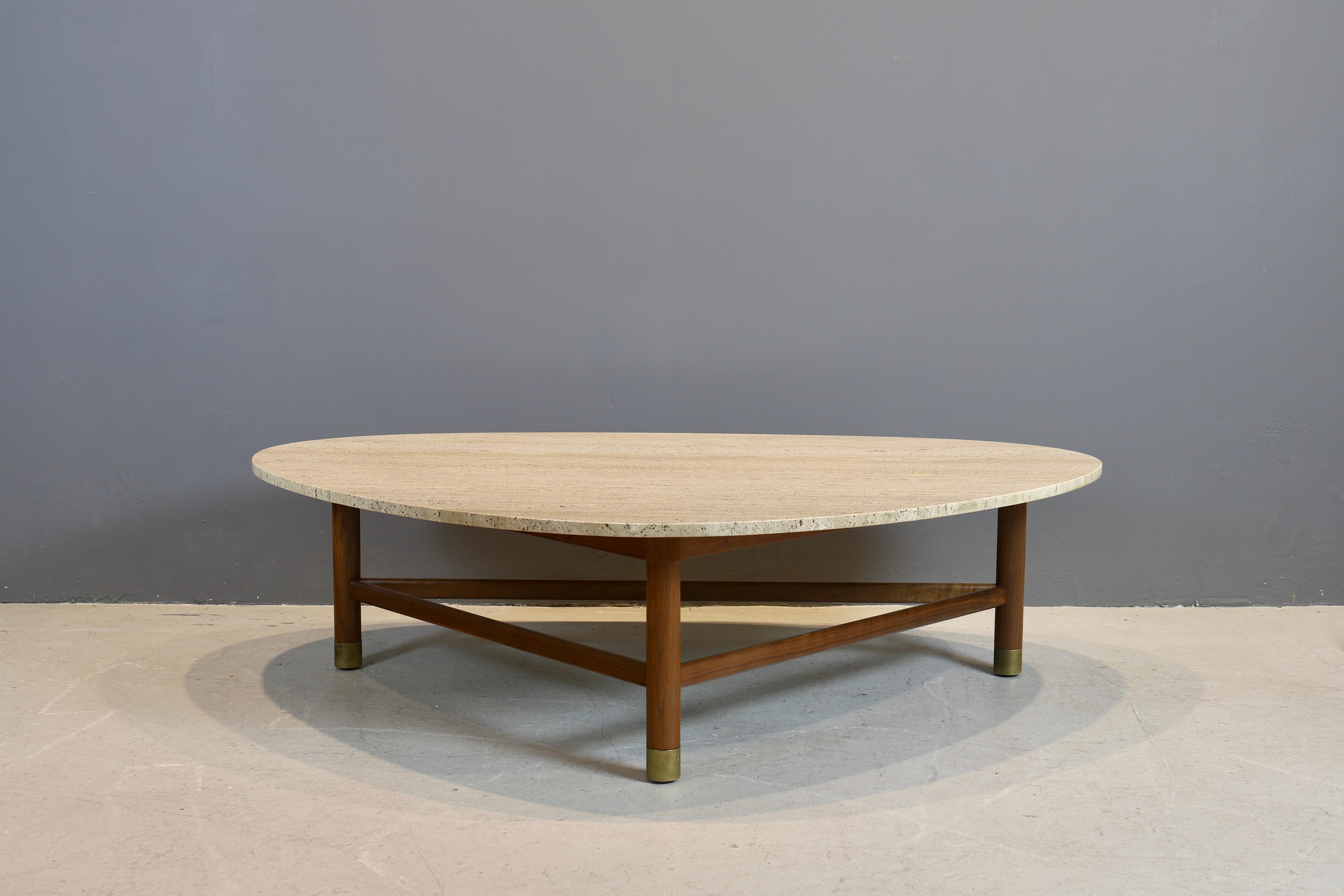 Harvey Probber coffee table with triangular shaped travertine top and walnut base.
Brass caps on feet.
Travertine top is original to the table.
You can view this table in my gallery in NYC.