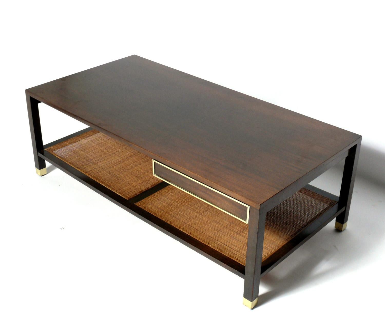 Harvey Probber coffee table, American, circa 1960s. Executed in mahogany, cane, and brass.