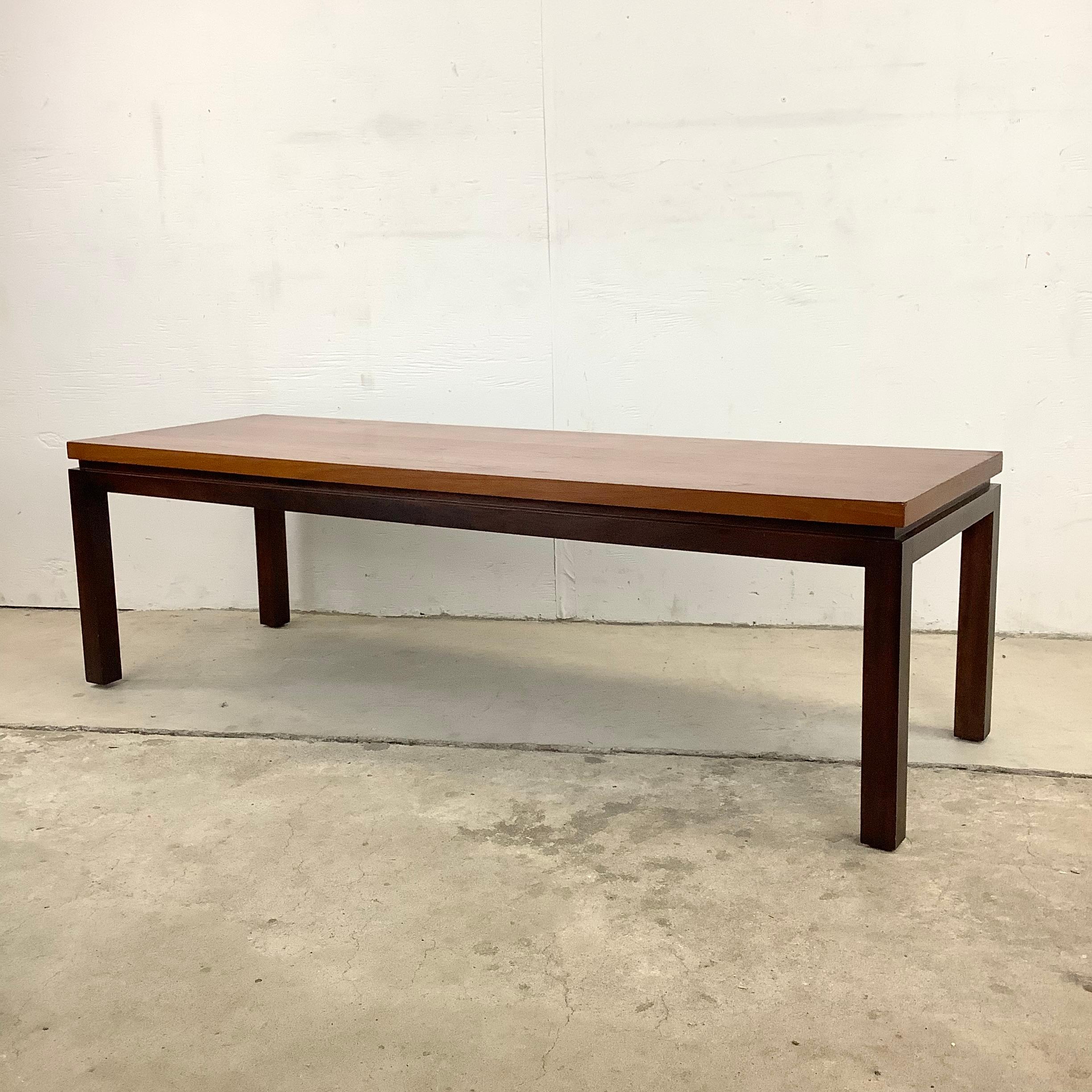 Striking Mid-Century Modern coffee table by Harvey Probber features floating top style with clean lines and two tone finish. The beautiful vintage design makes the perfect center piece to any interior seating area. Manufacturers tag affixed to