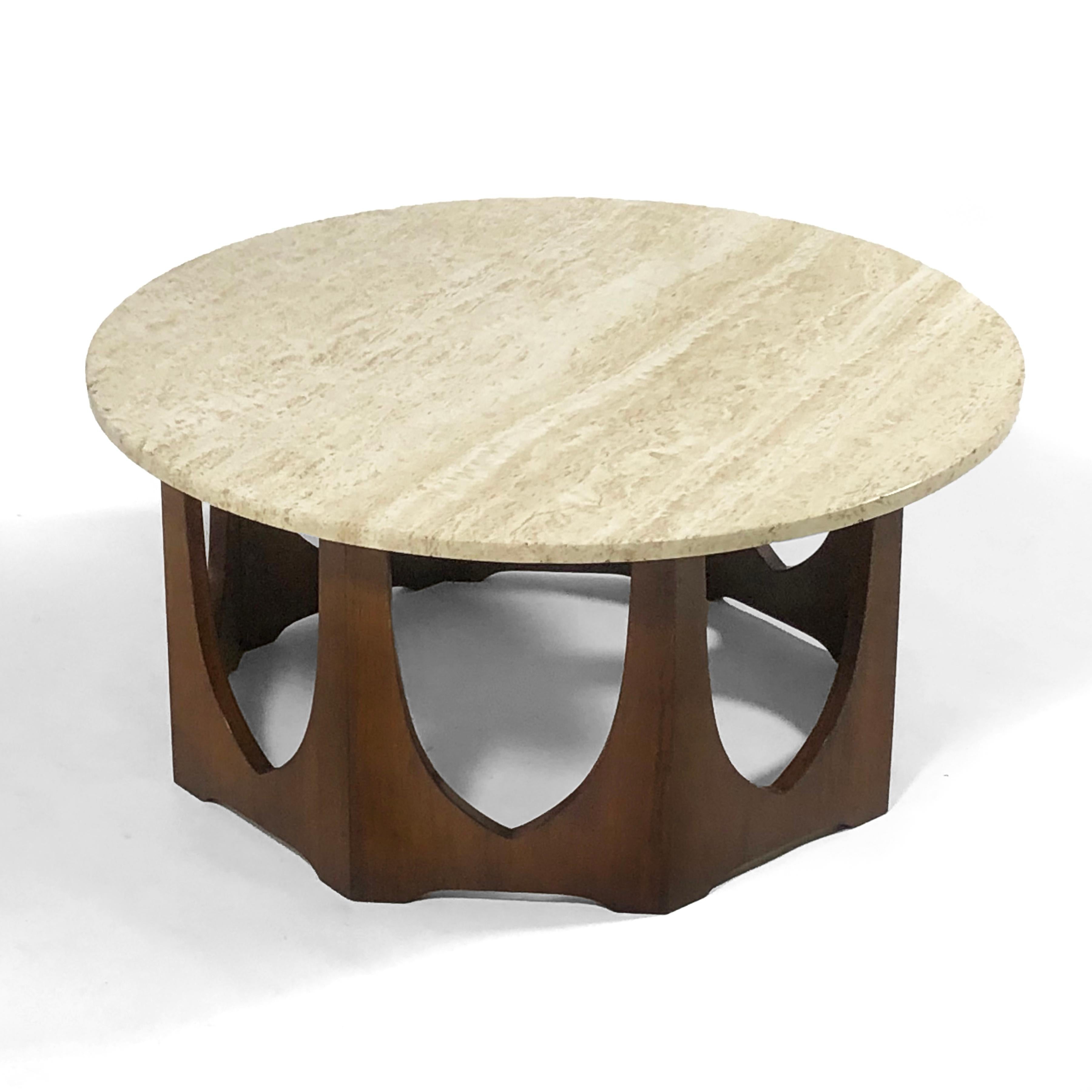This handsome cocktail table by Harvey Probber has a mahogany base and travertine top. The warm palate and natural materials are a pleasing compliment to any interior.