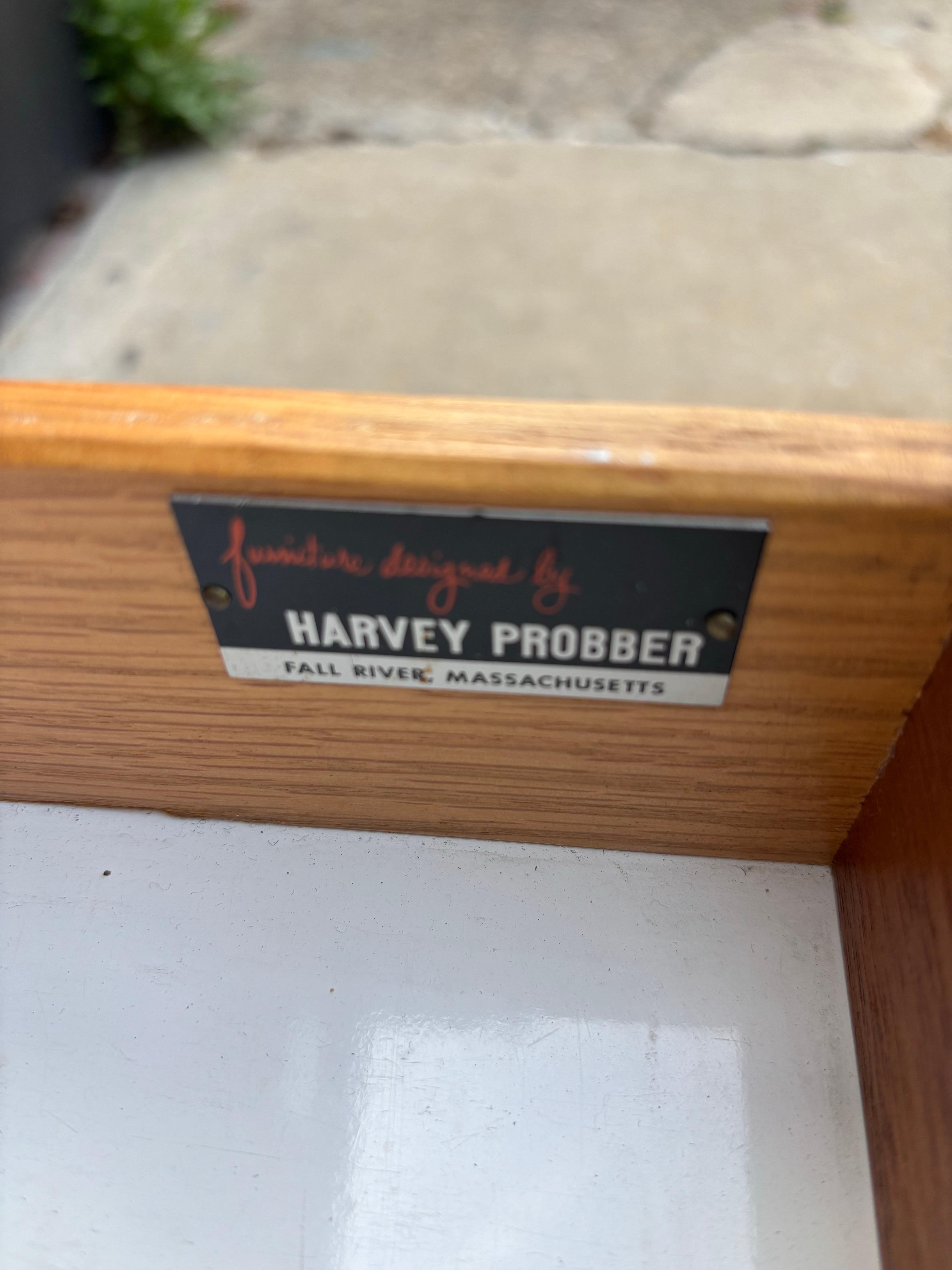 Harvey Probber Credenza with 2 vinyl and brass sliding doors and pull out drawers.  Formica Top is very convincing!  In fact I will admit I thought it was wood when I bought the piece!  Replaced legs give the cabinet a floating appearance!  Overall
