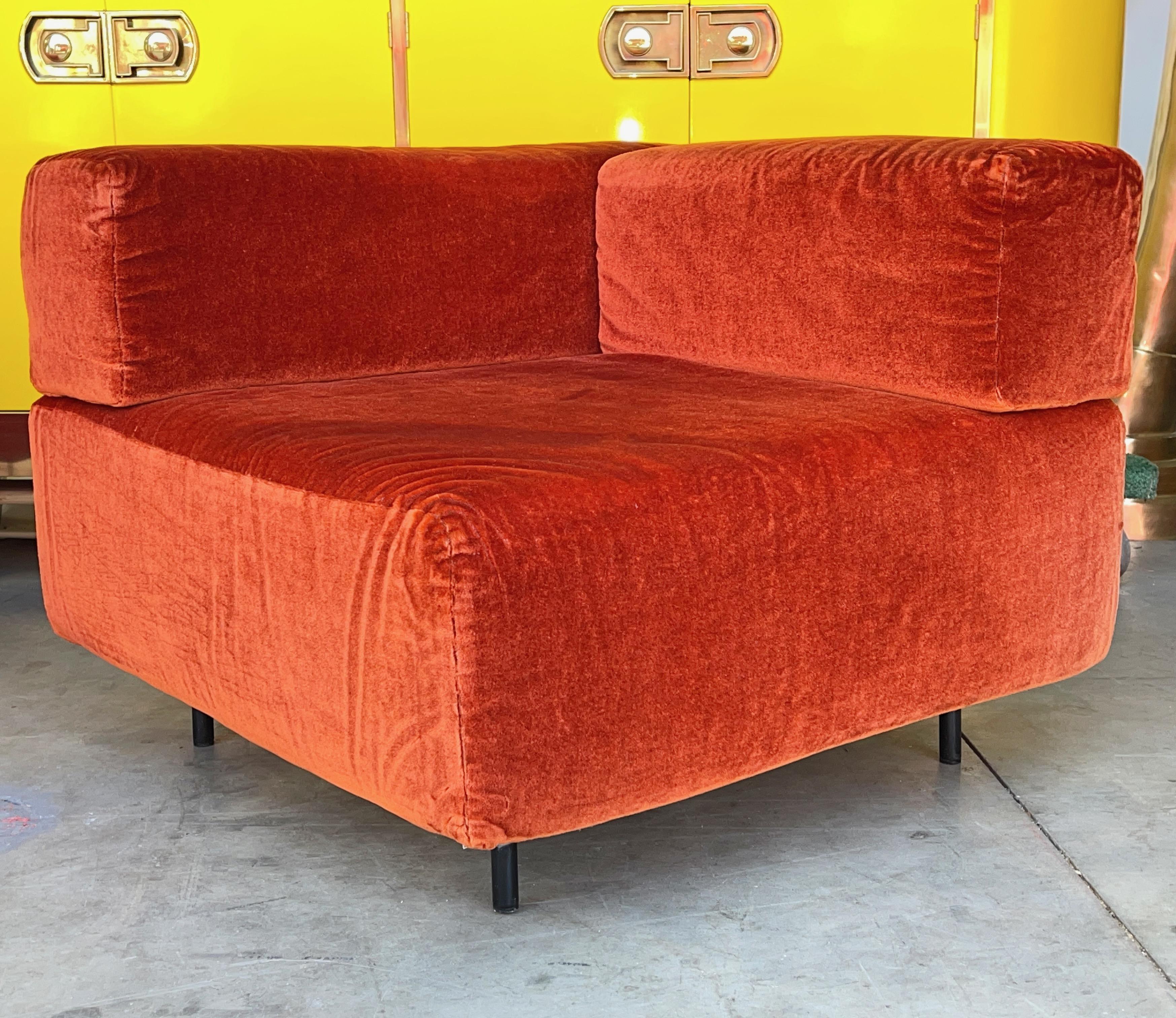 Original corner segment from Harvey Probber's Cubo sectional seating group.
Original plush velour covers unzip to be removed for cleaning.
Stainless steel tubular legs extend up through the seat and secure the two backrests in place.
The legs