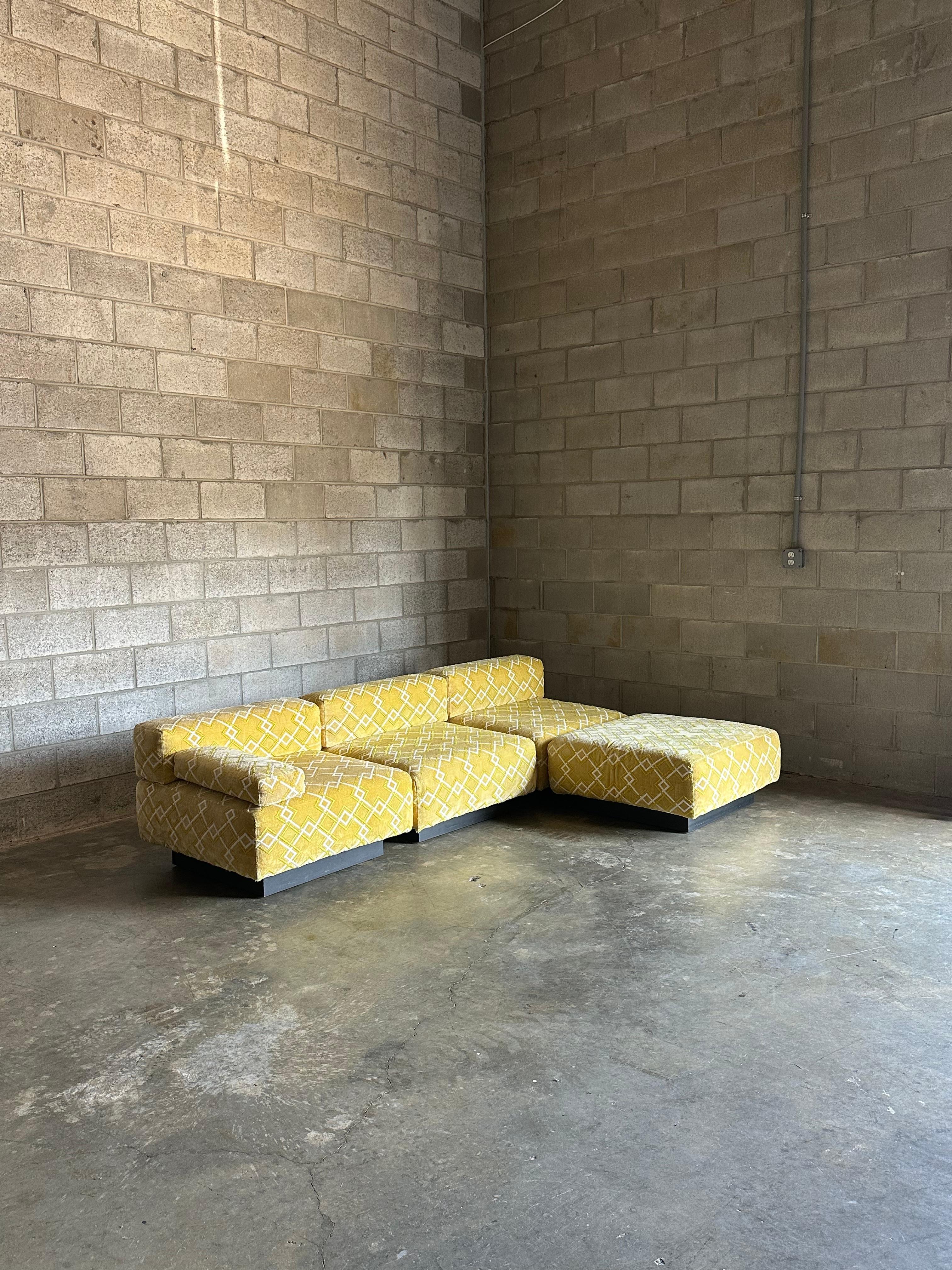An iconic sectional by Harvey Probber consisting of 4 seating pieces total. (3 seating surfaces with back, and 1 ottoman). Pieces can be configured in a number of ways. Also included is a single arm rest. 

Each seat is 32