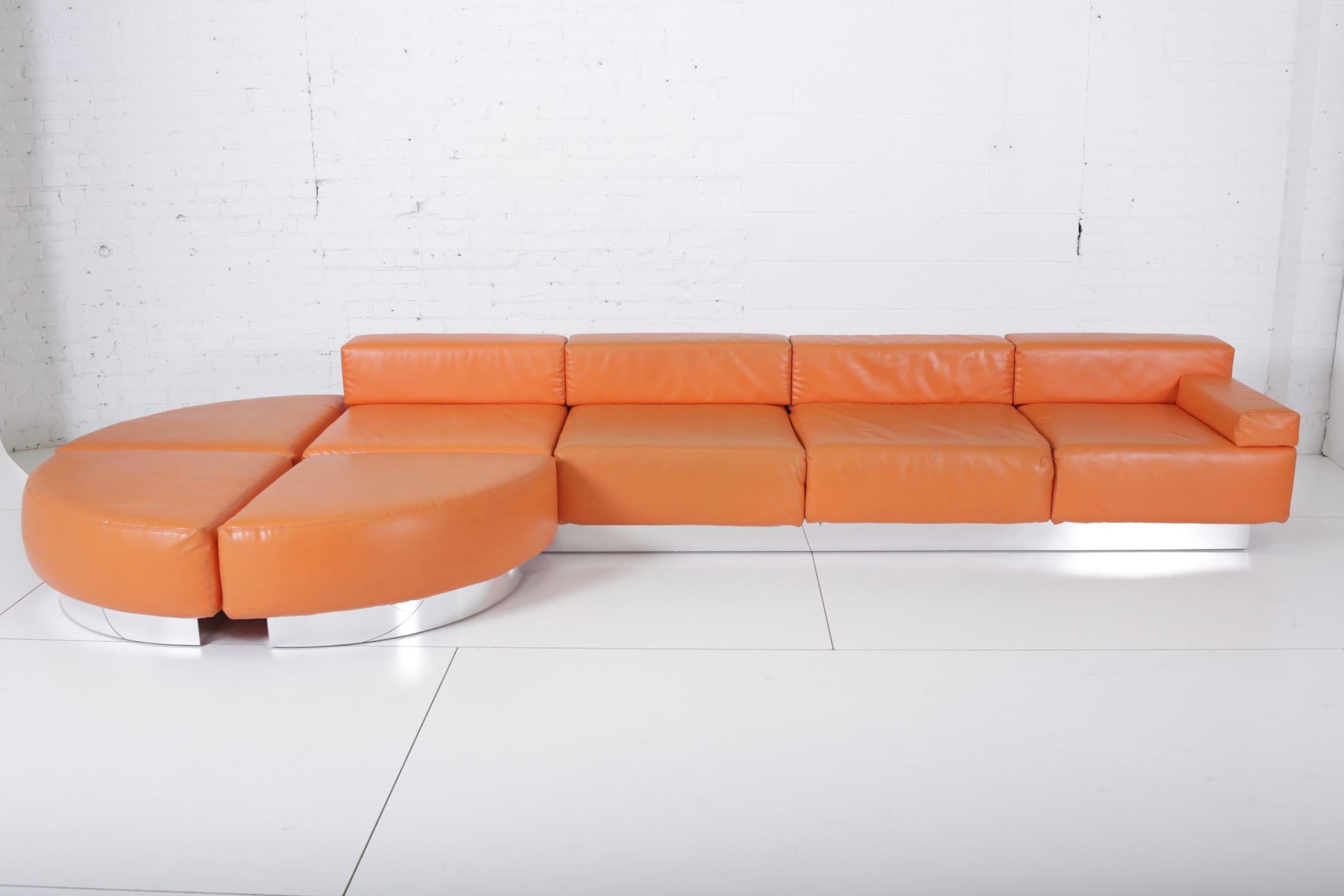 Cubo sofa by Harvey Probber. This large sofa consists of 4 seating sections that fit into 1 chrome base and 3 individual ottomans. Original vinyl shows wear.
 
 
    