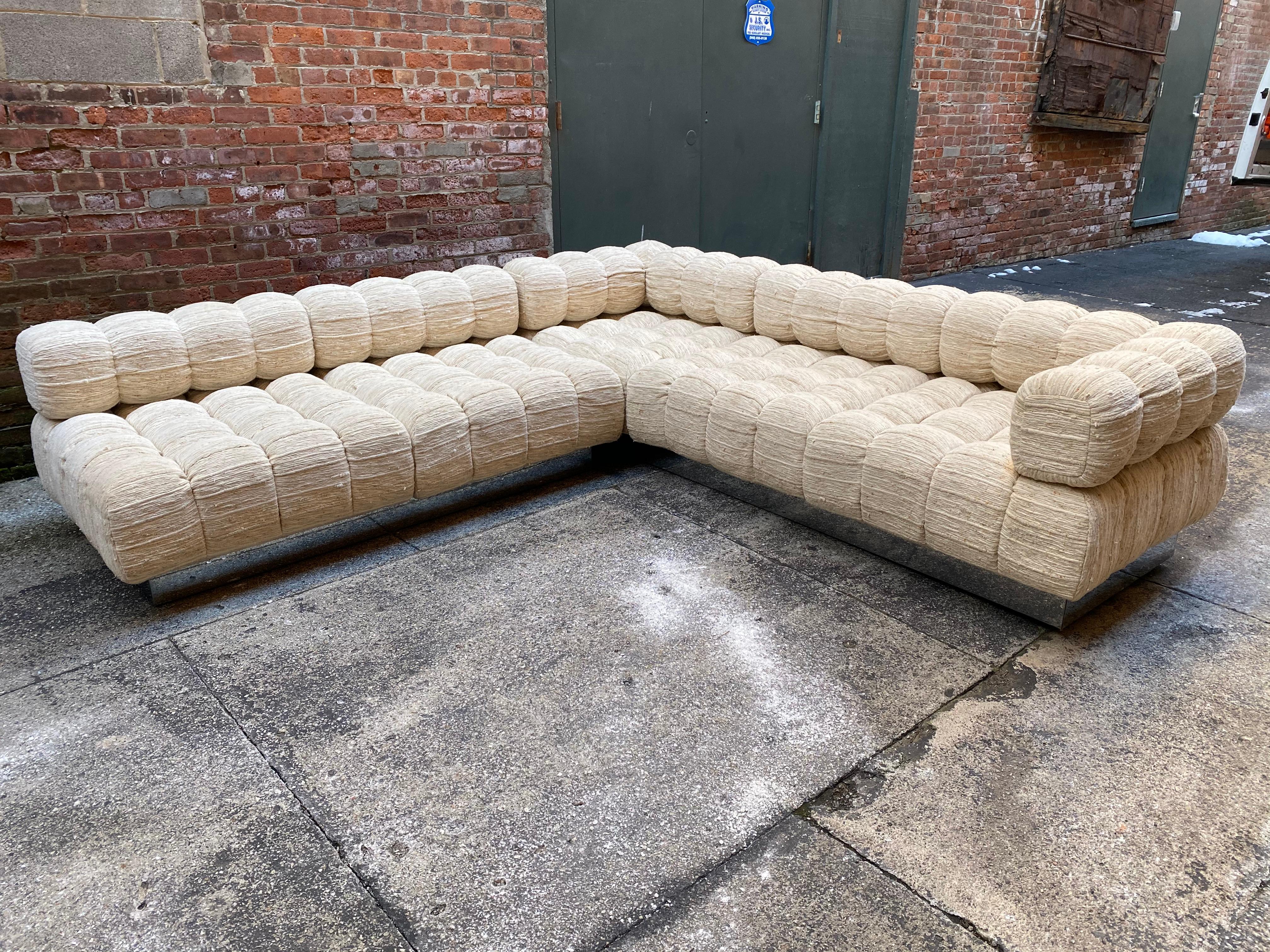 Two piece deep tuft sectional sofa designed by Harvey Probber. The two-piece features deep tuft cushions on a chrome plinth base. The original fabric is 