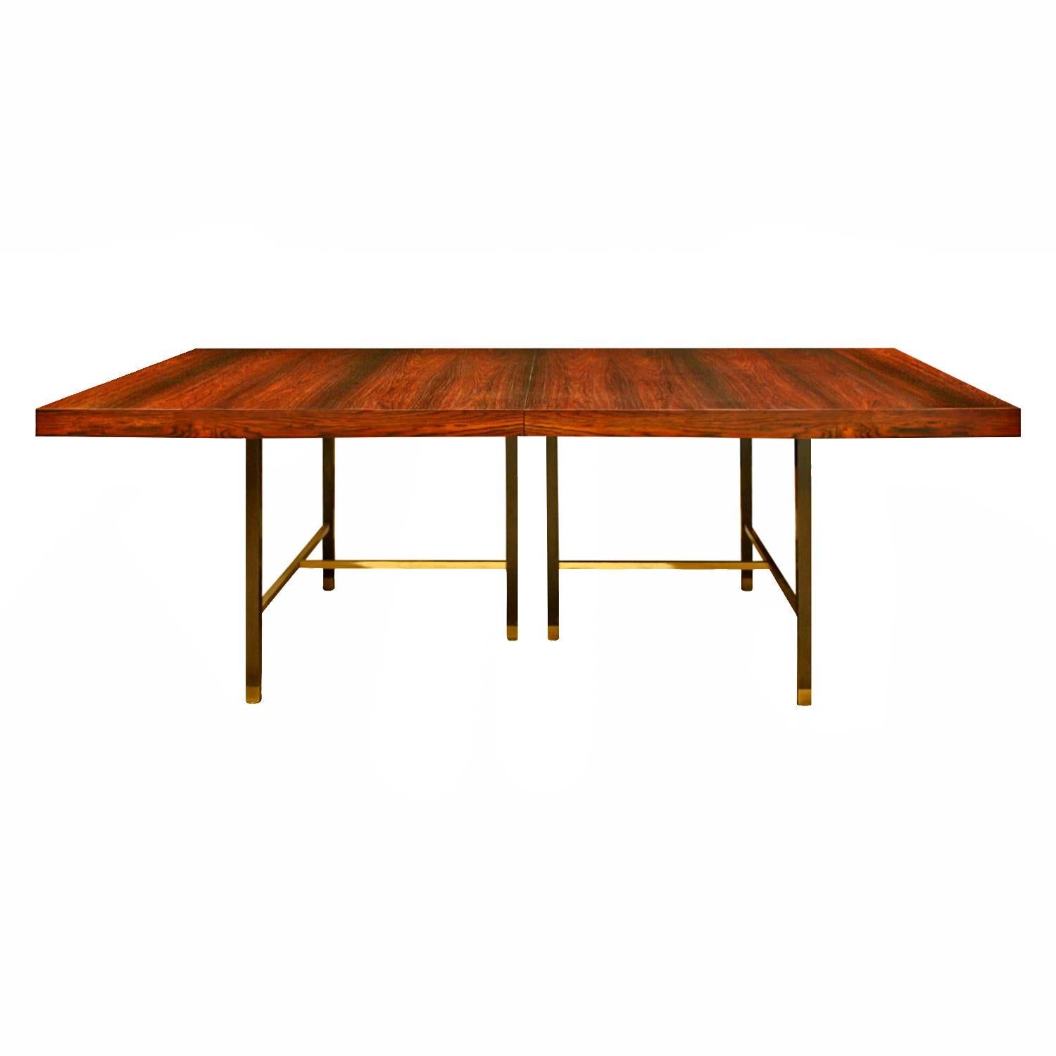 Dining table No. 1287 in book-matched Brazilian rosewood with brass stretchers and mahogany legs by Harvey Probber, American 1950's. Comes with 2 additional leaves. Signed with label on bottom that reads “Furniture designed by Harvey Probber”. This
