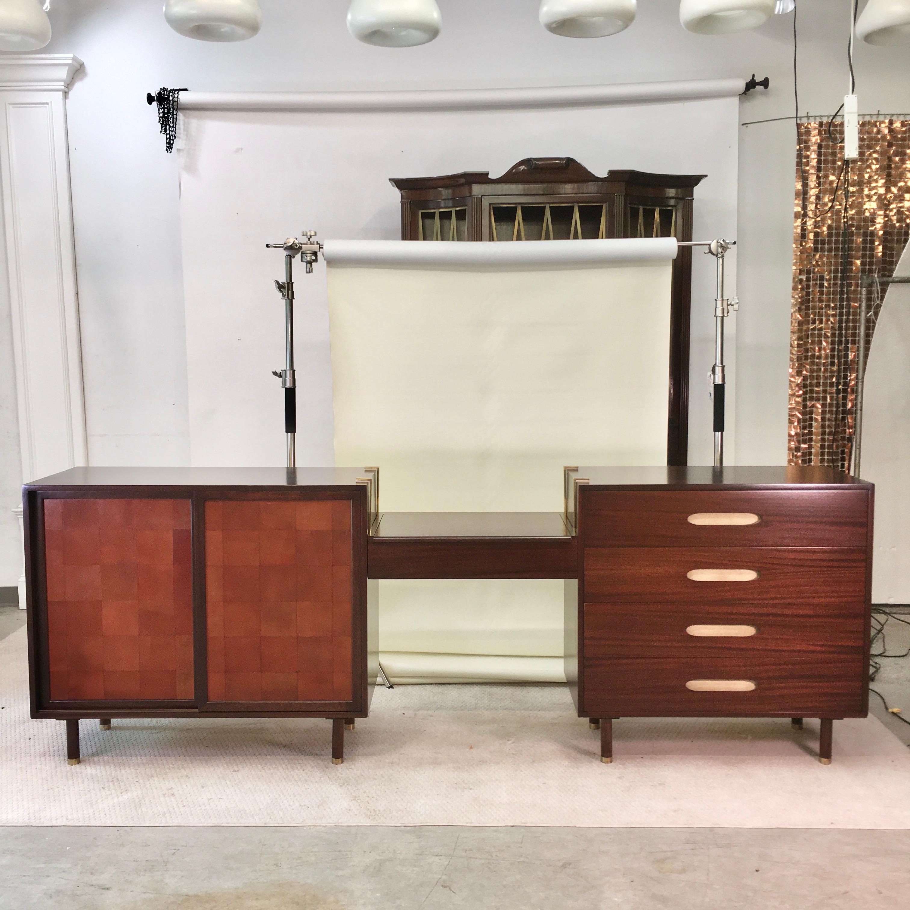 Two beautifully restored complimentary chests flanking a hanging vanity case from Harvey Probber's 
