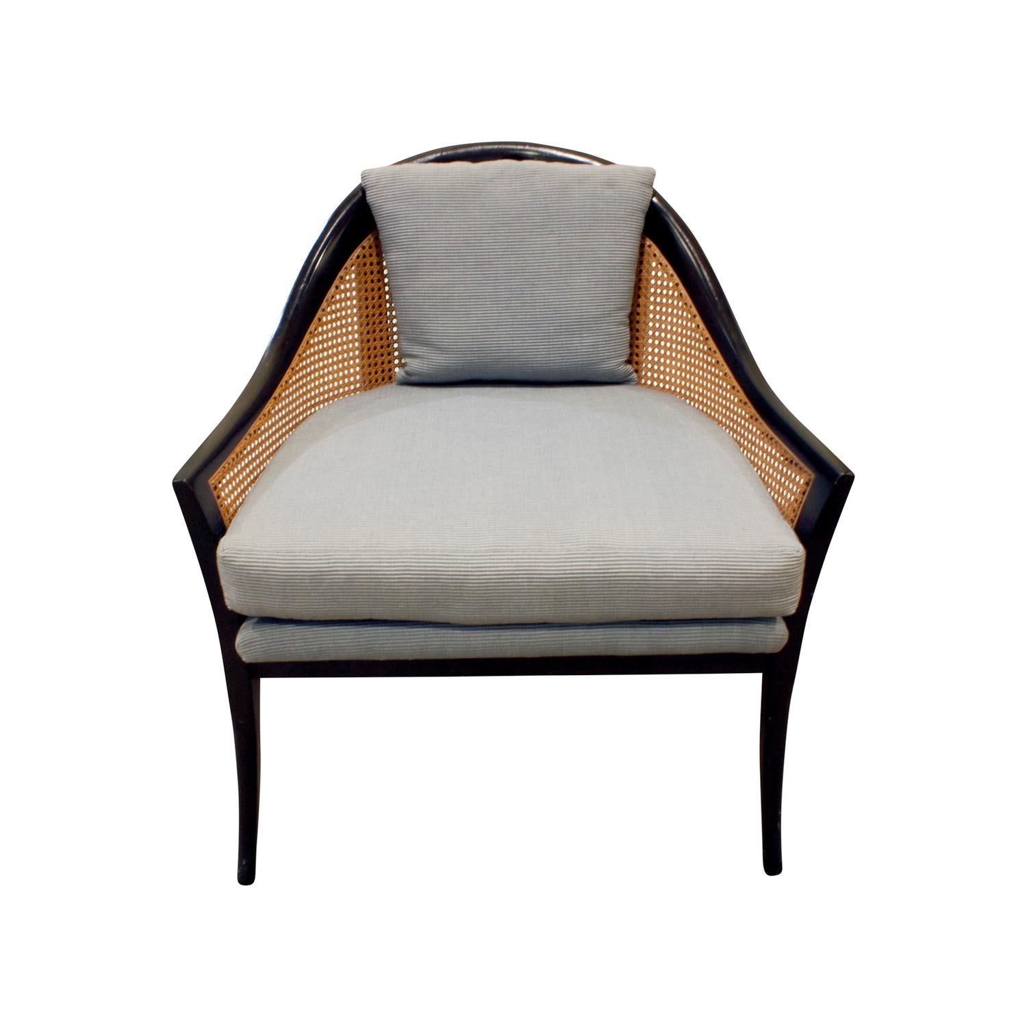 Pair of elegant lounge chairs model no. 915 in mahogany with caned backs and sides with upholstered seats and pillow by Harvey Probber, American, 1950s.