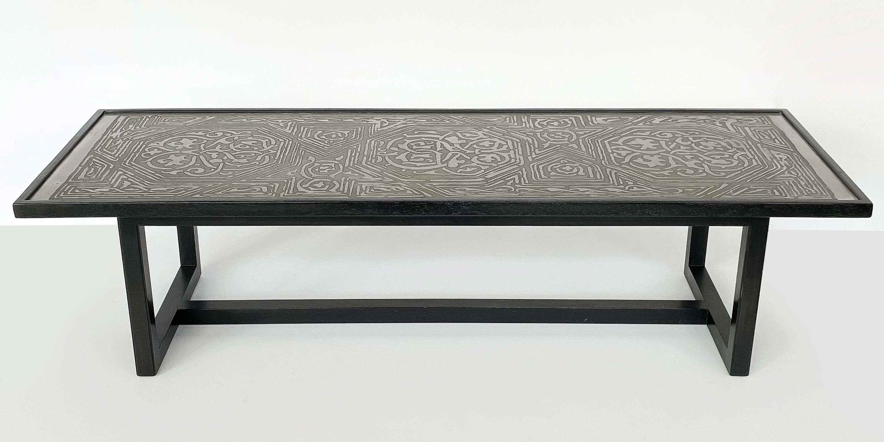 A rare coffee table No. 1322 with etched metal top and black ebonized mahogany frame by Harvey Probber, circa 1950s. Clean lined mahogany frame with black ebonized finish. Possibly refinished at an earlier point in this table's life. The intricate