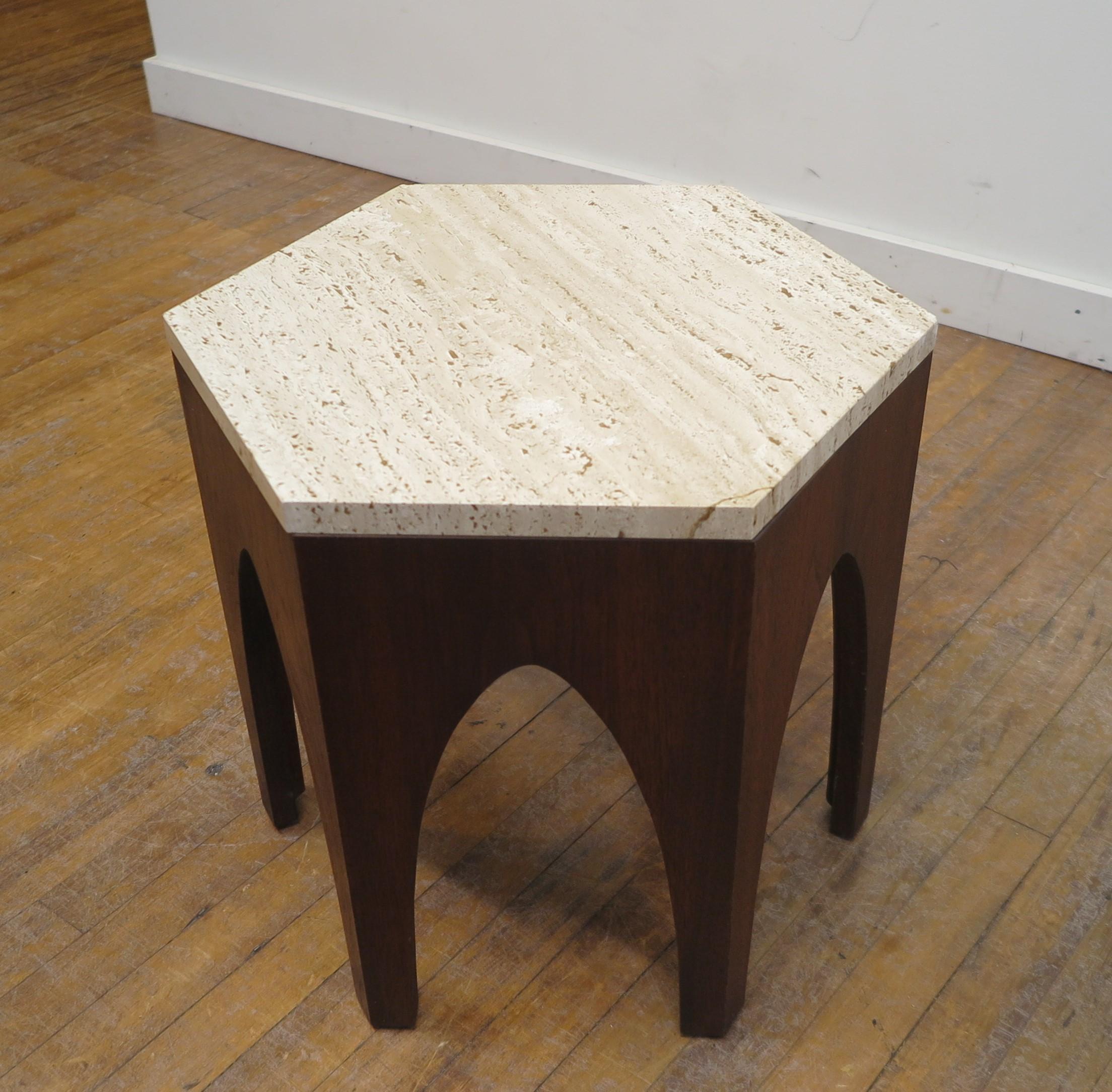 Mid-Century Modern hexagon travertine side table by Harvey Probber. Travertine marble top on walnut base with arched legs and hexagon shape. Iconic Harvey Probber design and style. In very good condition, all original. Small ware to a couple of