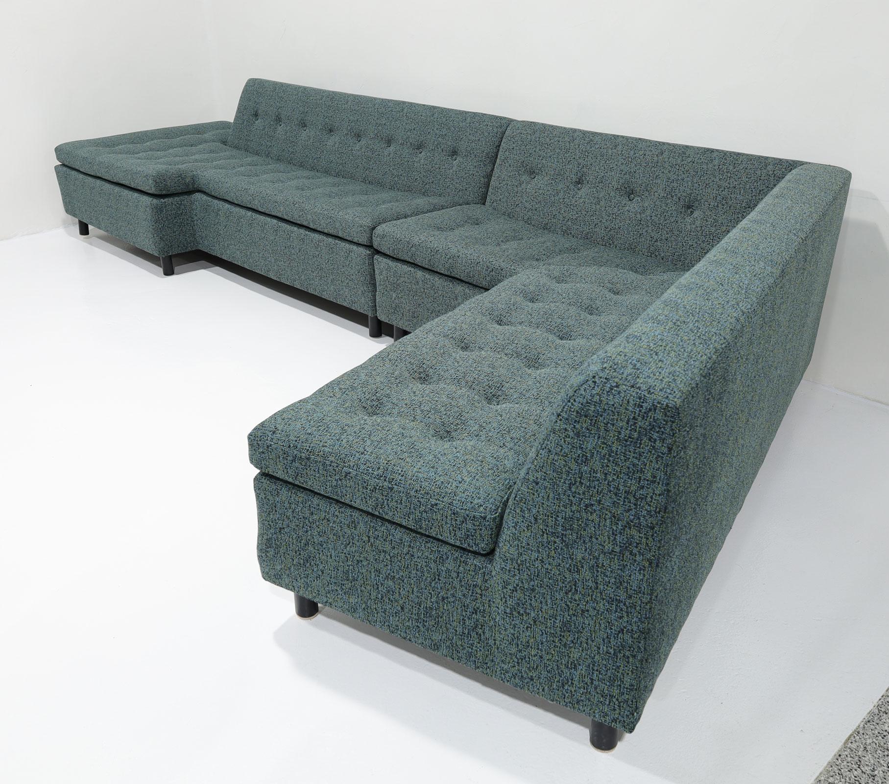 A stunning two-part sofa by Harvey Probber. We have reupholstered in a rich tight weave wool that enhances the clean lines of this beautiful sofa. The individual sections measure 88