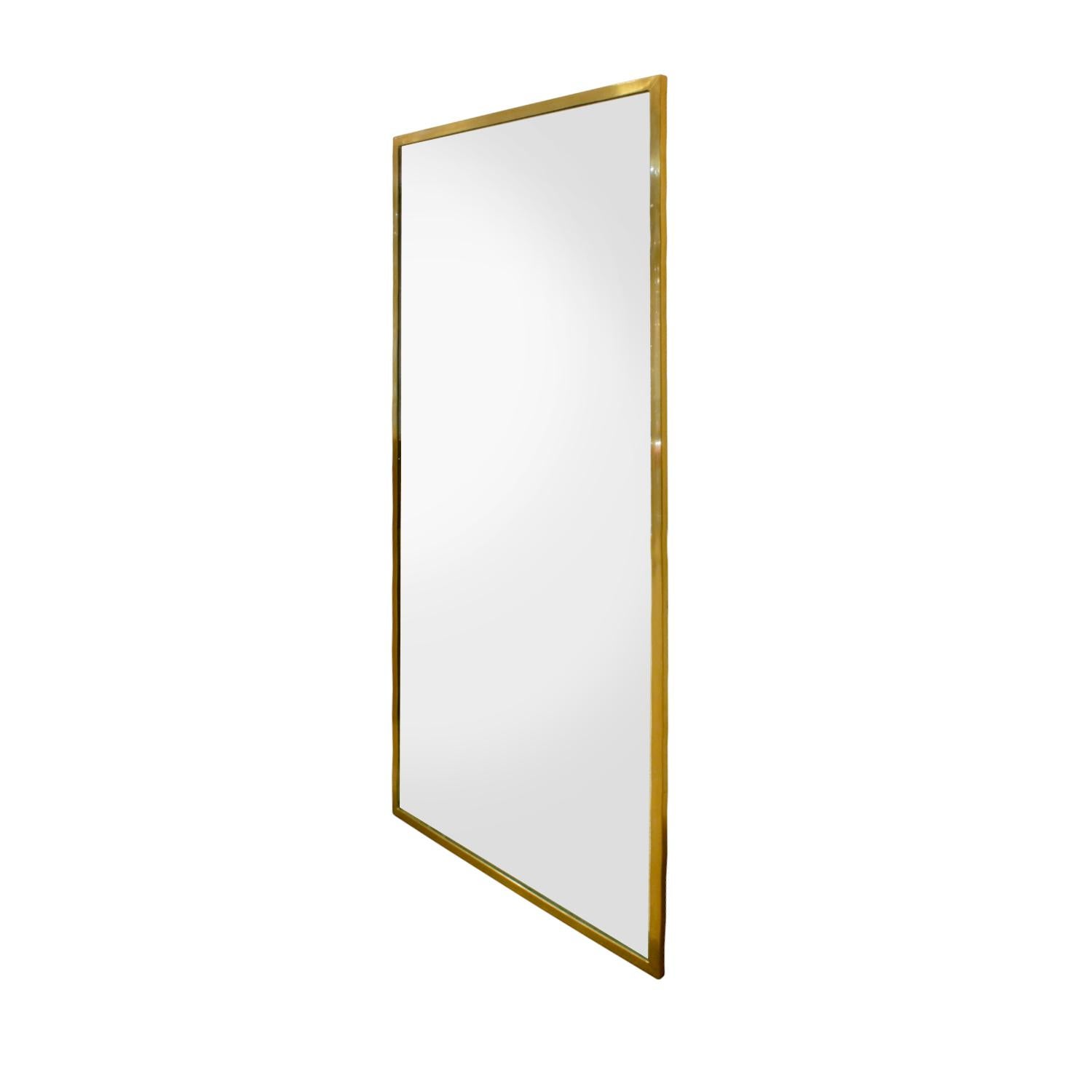 Large rectangular mirror with brass frame by Harvey Probber, American, 1950s.