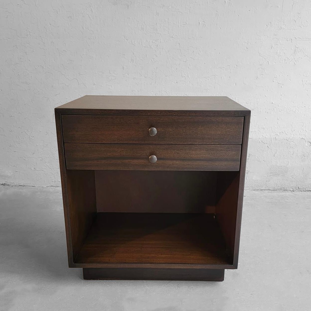 Single. Mid-Century Modern, mahogany end table or nighstand by Harvey Probber features two drawers with open storage space on a platform base.