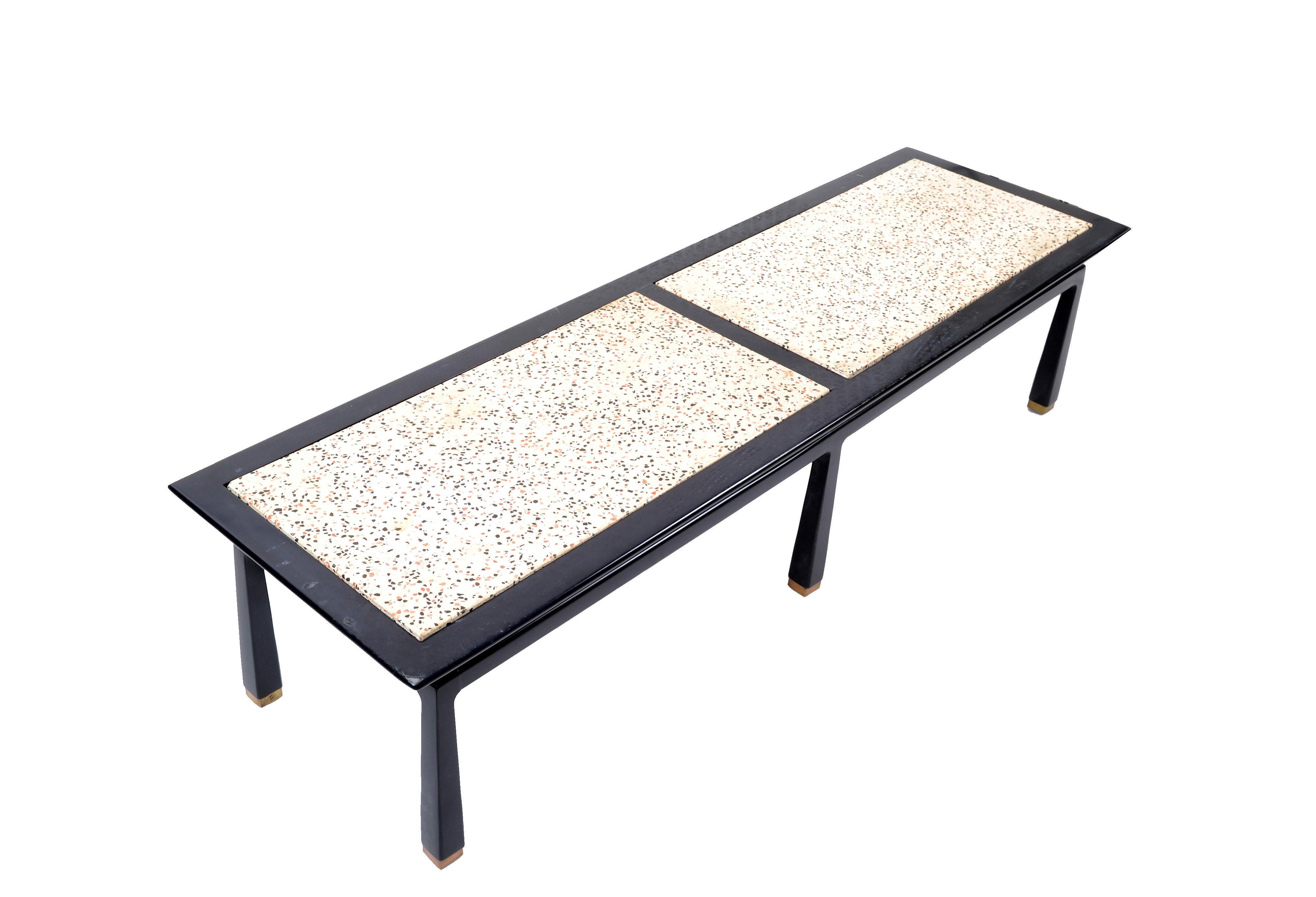Chinoiserie inspired Mid-Century Modern rectangular coffee table by Harvey Probber.
The table features a wooden frame with two heavy travertine tops.
The legs have brass covers.
Lovely 1970s Asian influenced style which fits to many interior