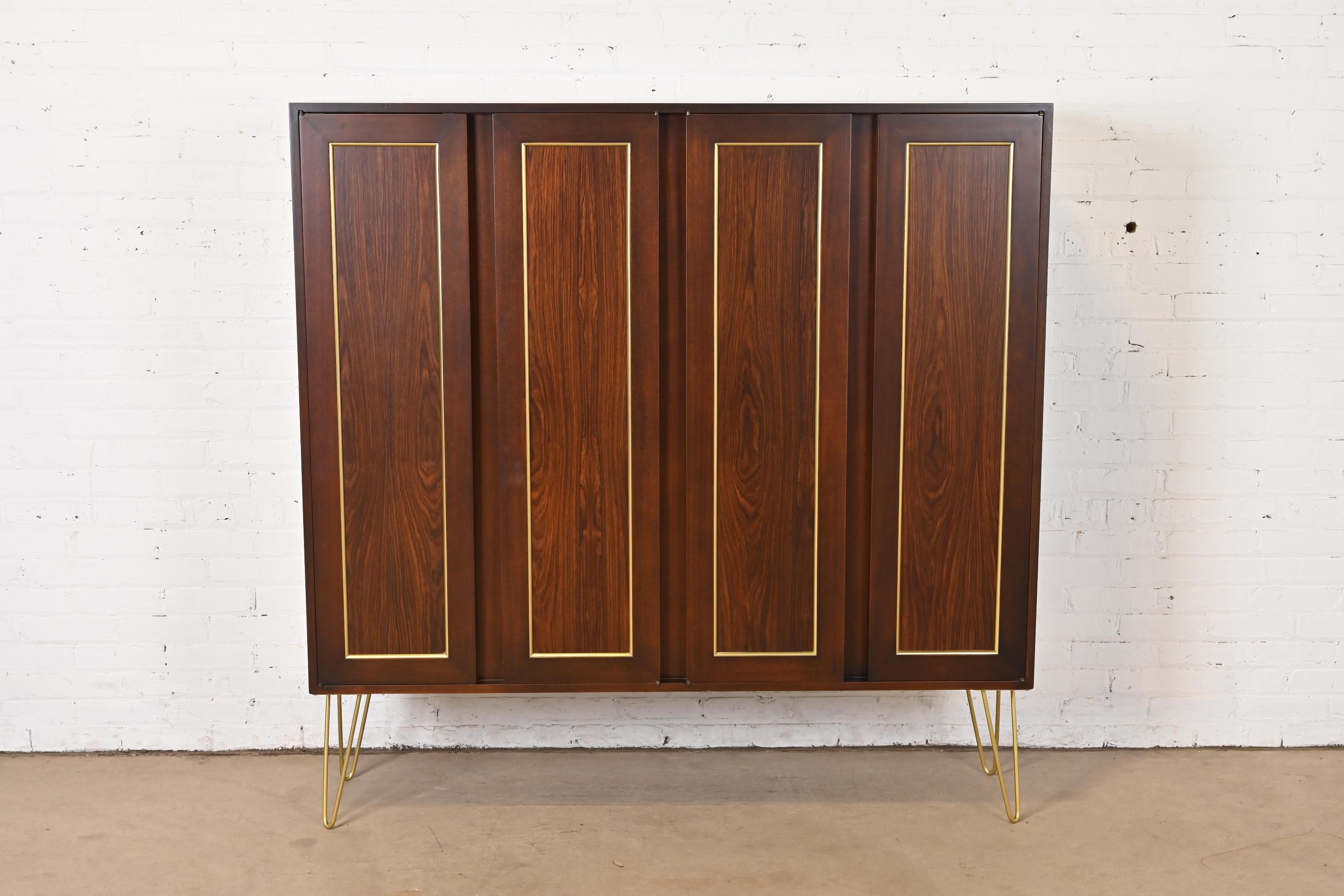 A gorgeous Mid-Century Modern bookcase cabinet

By Harvey Probber

USA, 1960s

Beautiful rosewood, with brass trim and brass finished steel hairpin legs.

Measures: 60