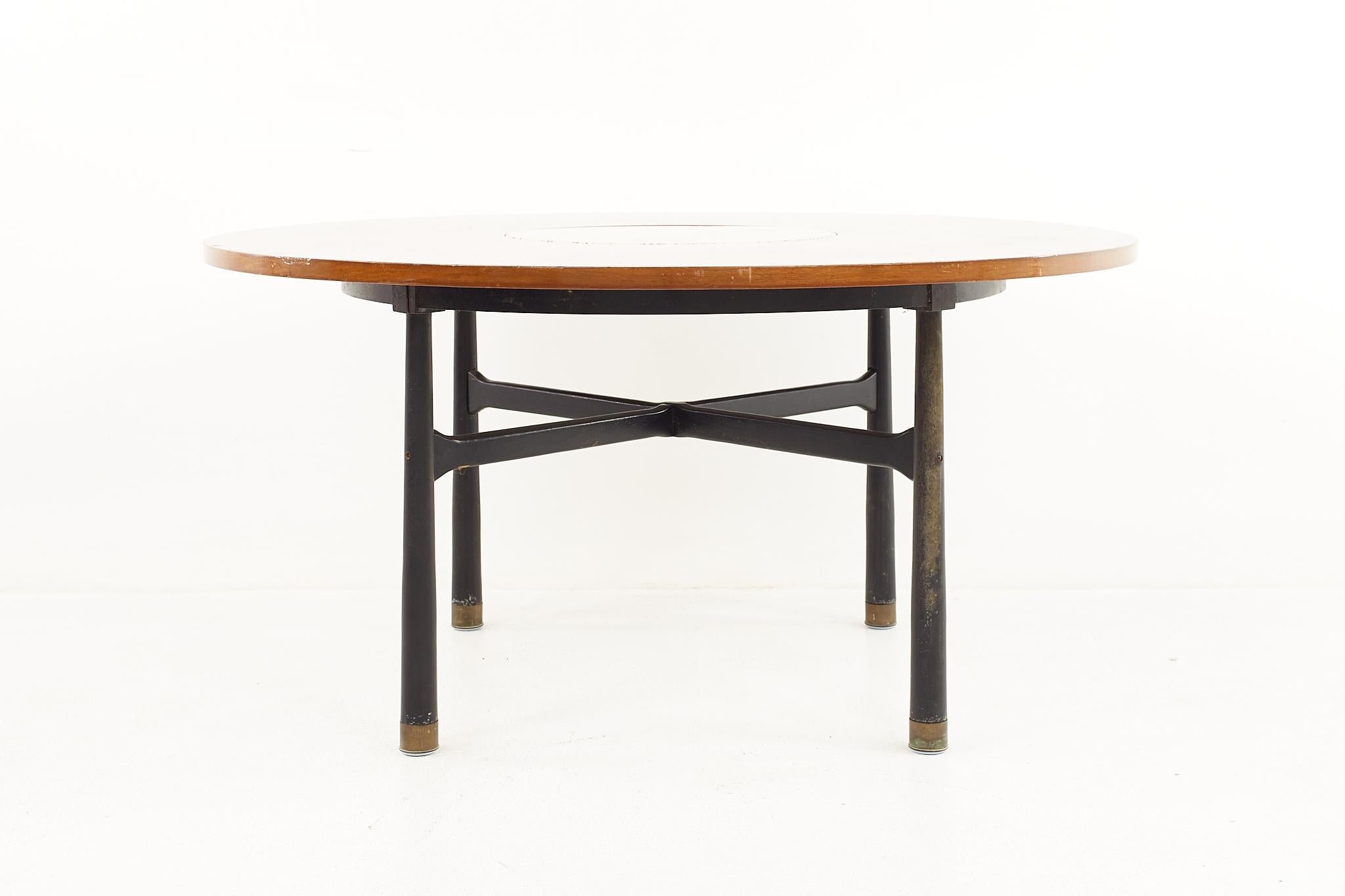 Harvey Probber mid century round ebonized walnut, terrazzo, and brass dining table

The table measures: 50 wide x 50 deep x 24.5 high, with a chair clearance of 23.25 inches 

Repair has been made to the terrazzo.

All pieces of furniture can