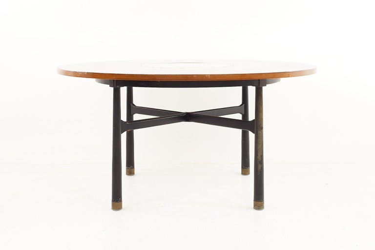 Harvey Probber mid century round ebonized walnut, terrazzo, and brass dining table

The table measures: 50 wide x 50 deep x 24.5 high, with a chair clearance of 23.25 inches 

Repair has been made to the terrazzo.

All pieces of furniture can