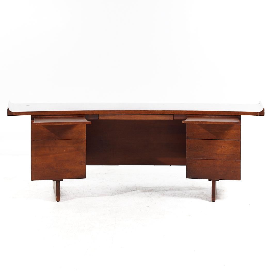 Harvey Probber Mid Century Walnut Curved Executive Desk

This desk measures: 92.25 wide x 34.5 deep x 29 high, with a chair clearance of 25.75 inches

All pieces of furniture can be had in what we call restored vintage condition. That means the