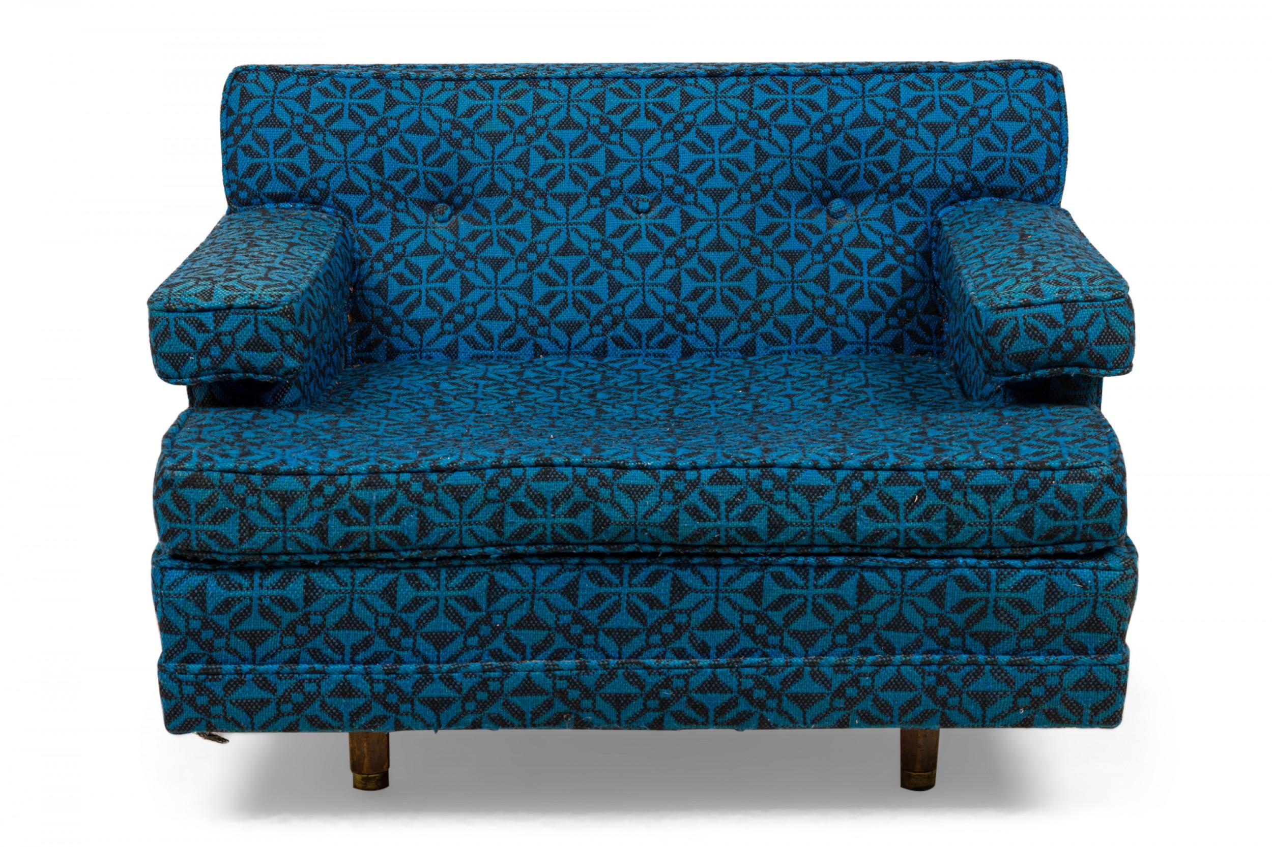 American Mid-Century oversized lounge / armchair upholstered in a bright. and dark blue geometric patterned fabric with matching bolster/back pillow. (HARVEY PROBBER)
 
