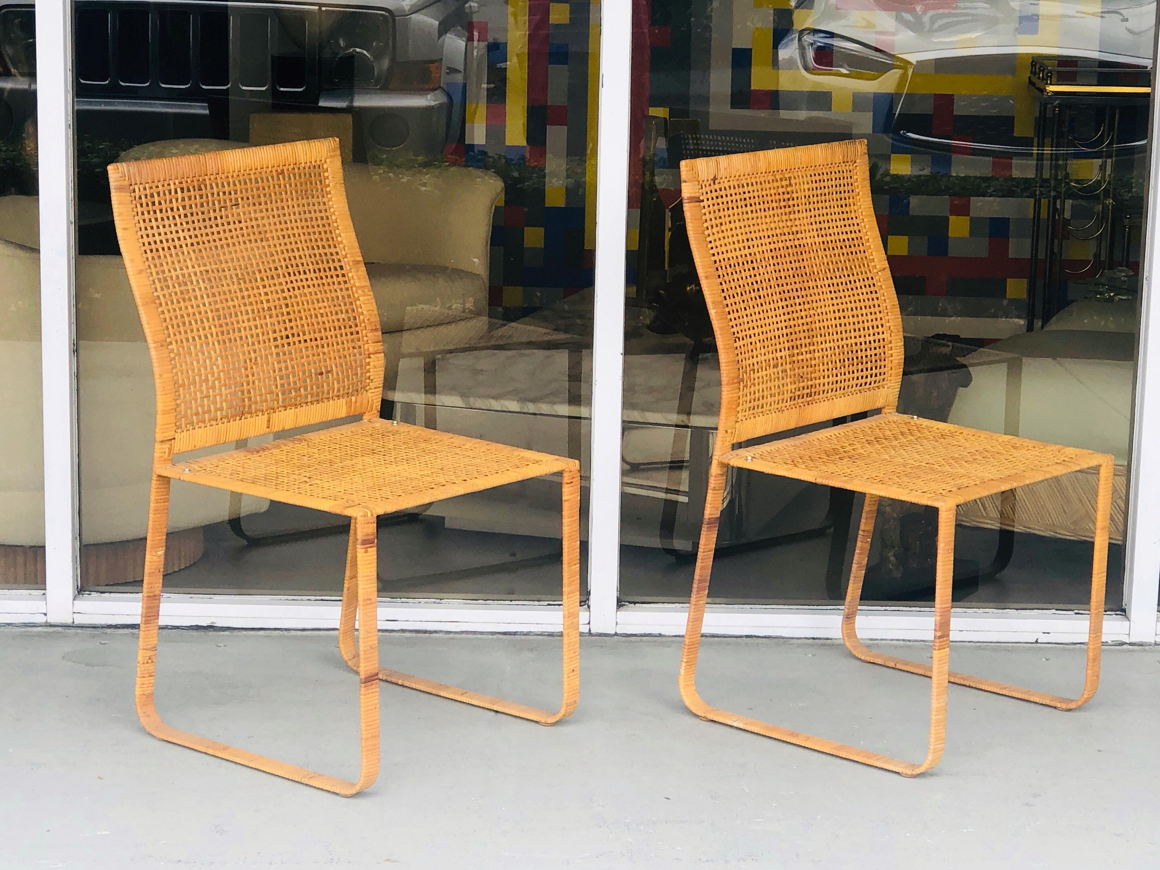 These chairs are spectacular in their apparent simplicity. Both retain the original removable leather cushions. Seat height is 20