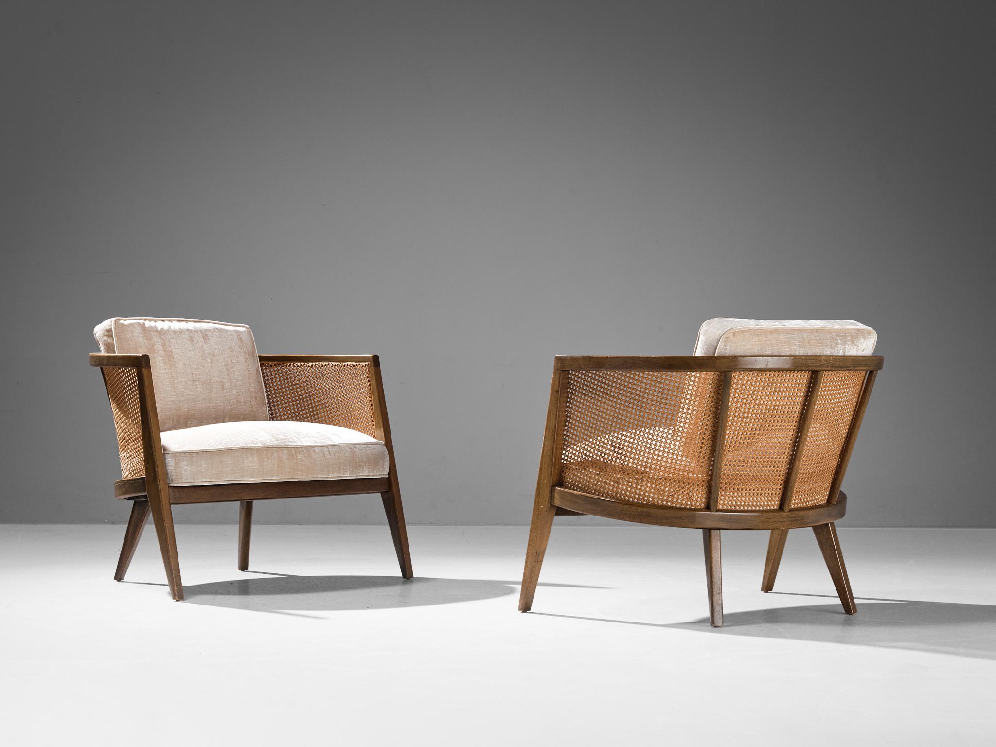 Harvey Probber, pair of 'Oval' easy chairs, model '1066', mahogany, cane, off-white velvet, United States, 1950s 

This pair of lounge chairs is conceived by American designer Harvey Probber around the fifties. The defining element of these chairs