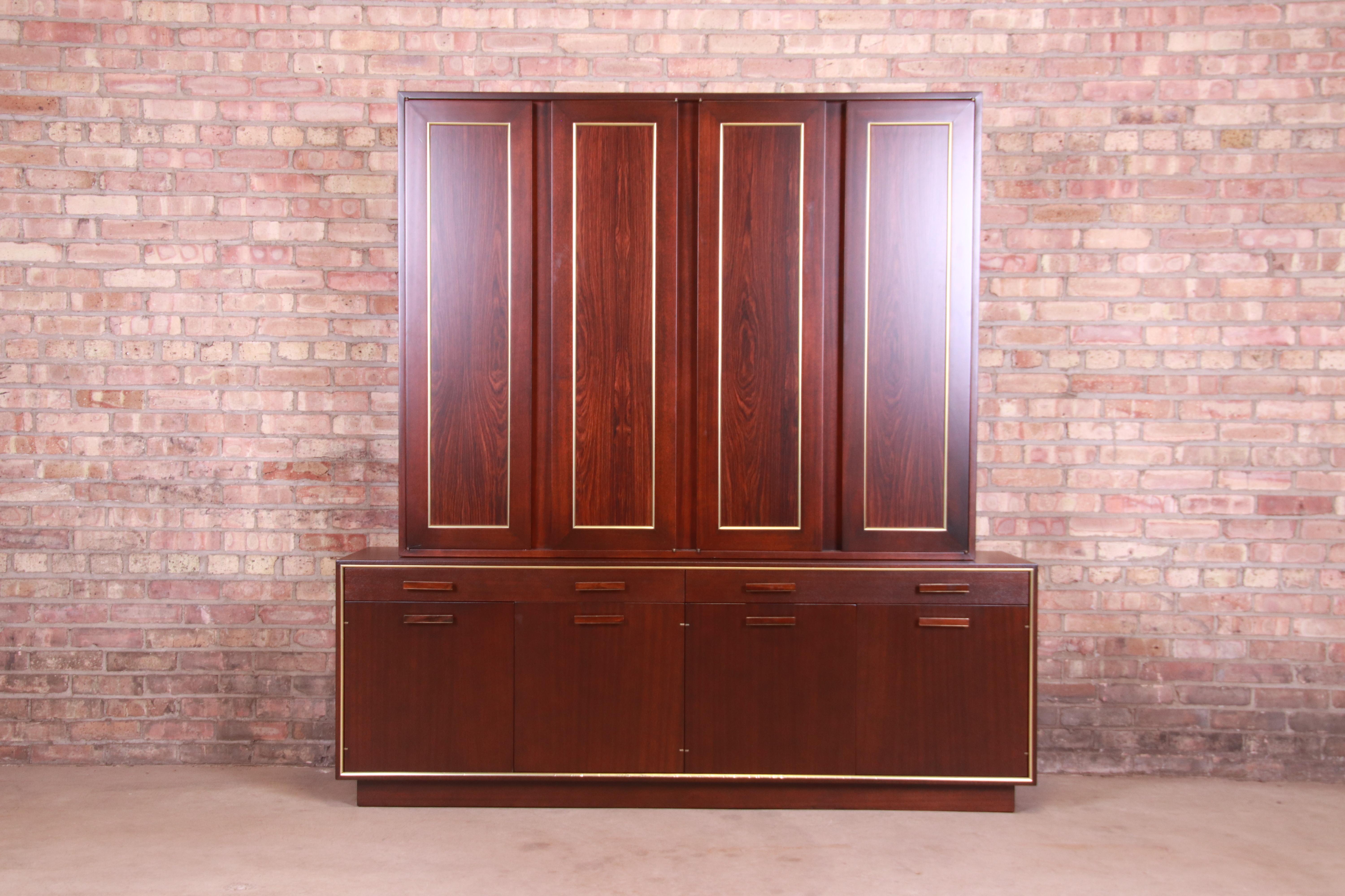 A gorgeous mid-century modern breakfront bookcase, sideboard, or bar cabinet

By Harvey Probber

USA, 1950s

Rosewood, with brass trim.

Measures: 71.25