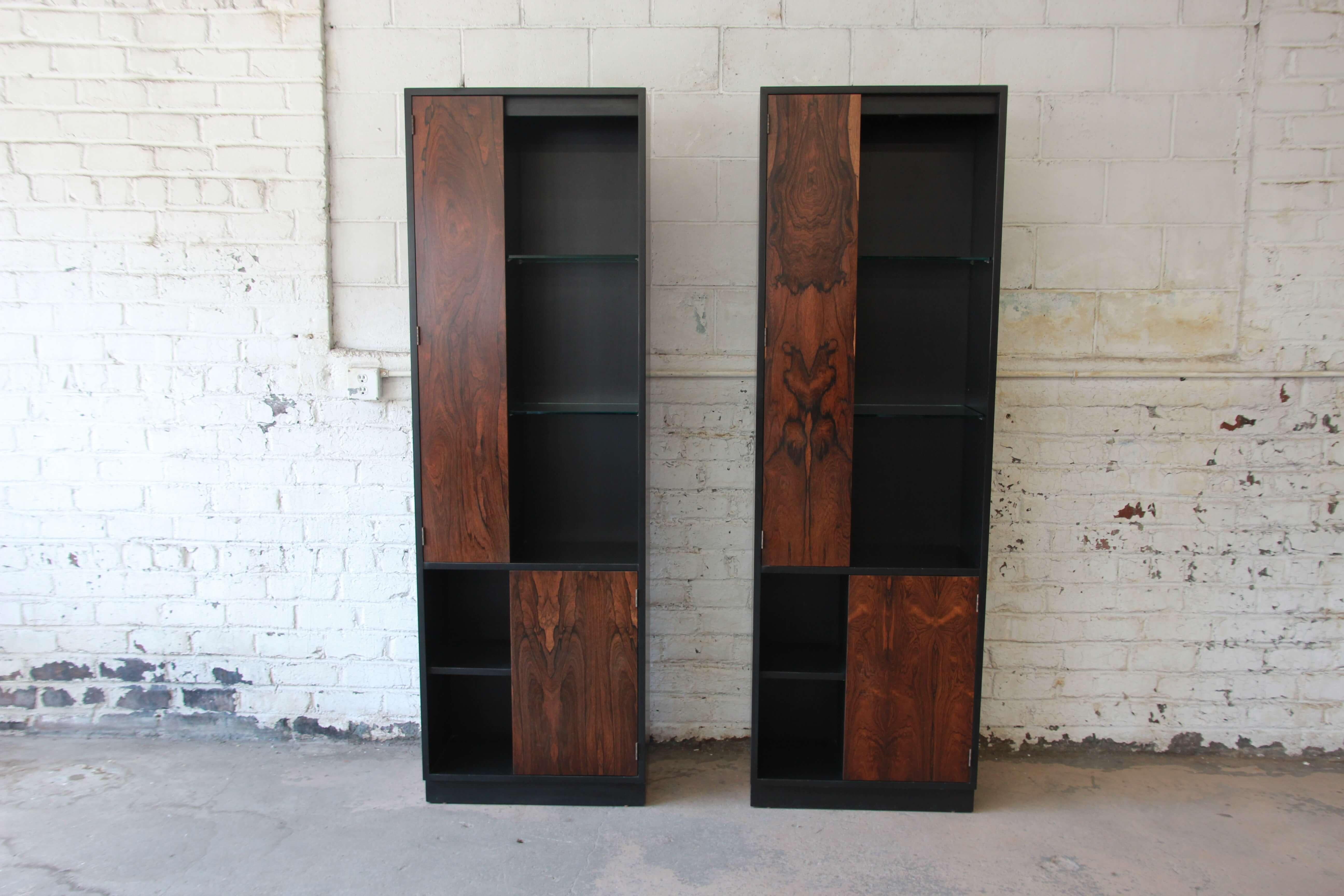 Offering an incredible pair of Harvey Probber cabinets with stunning rosewood and ebonized wood. Each cabinet has a unique rosewood grain. The cabinets can be push together or left separated as pictured. Each cabinet has a long rosewood door on the
