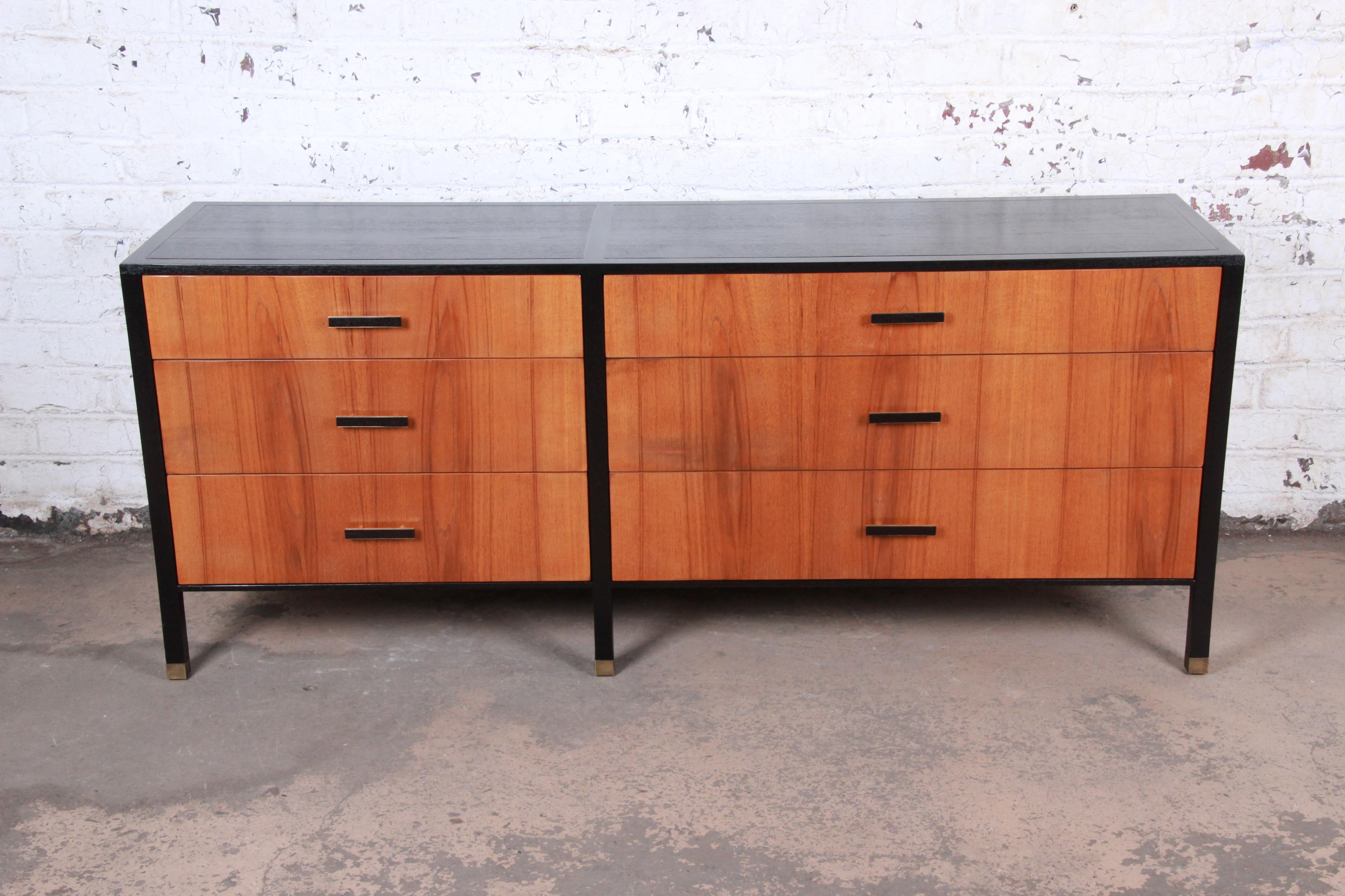 An exceptional Mid-Century Modern long dresser or credenza

Designed by Harvey Probber

USA, 1960s

Bookmatched rosewood and ebonized wood and brass hardware

Measures: 76