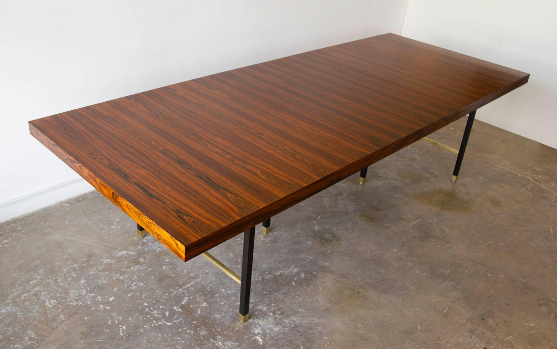 Brazilian rosewood Harvey Probber architectural dining table with mahogany clad solid steel legs and solid brass stretchers. The tables measures 80 x 44 x 29