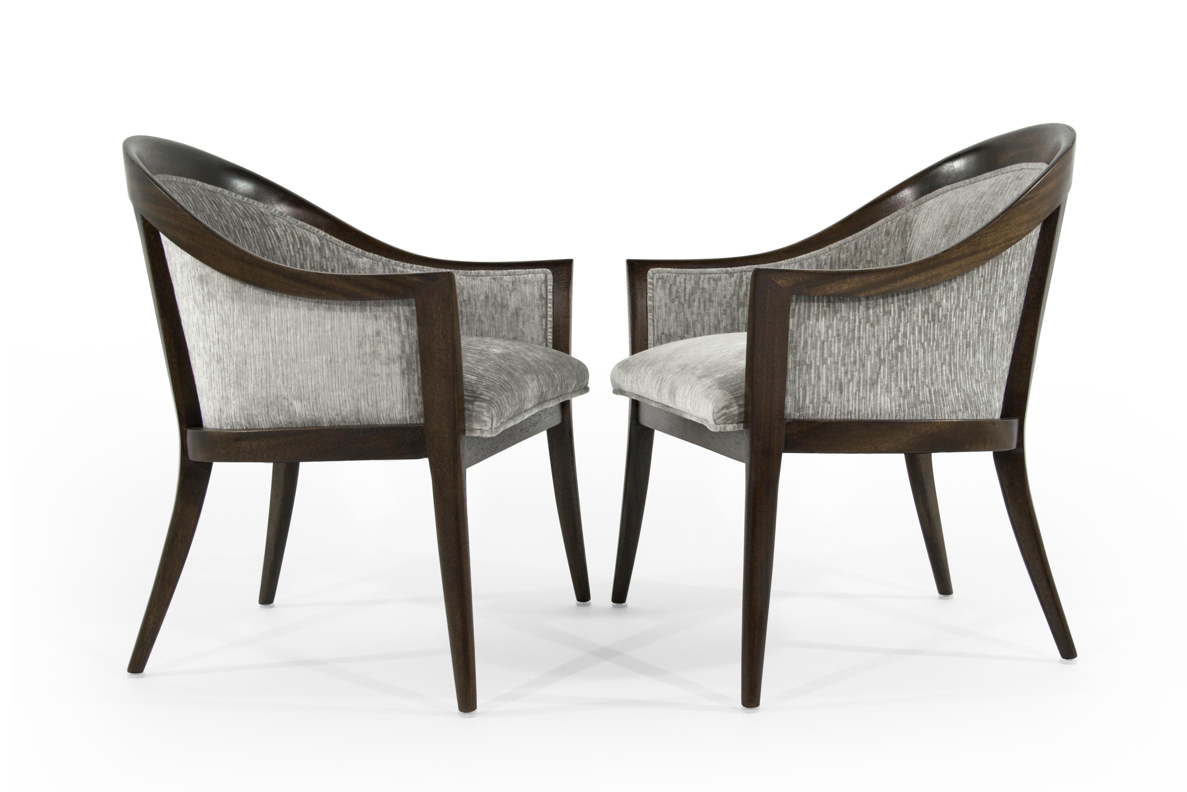 Pair of lounge chairs designed by Harvey Probber, circa 1950s.

Sculptural mahogany framing fully restored. Newly upholstered in grey chenille.