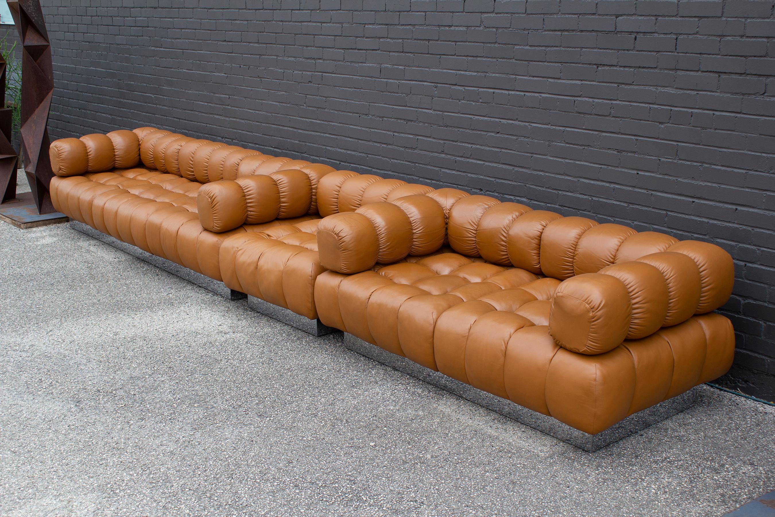 This three-piece Harvey Probber sectional seating arrangement includes a three-seater sofa, a two-seater settee, and an armless lounge chair in the
original Cognac Leather. This is the sexiest and most iconic design from Probber, who is often