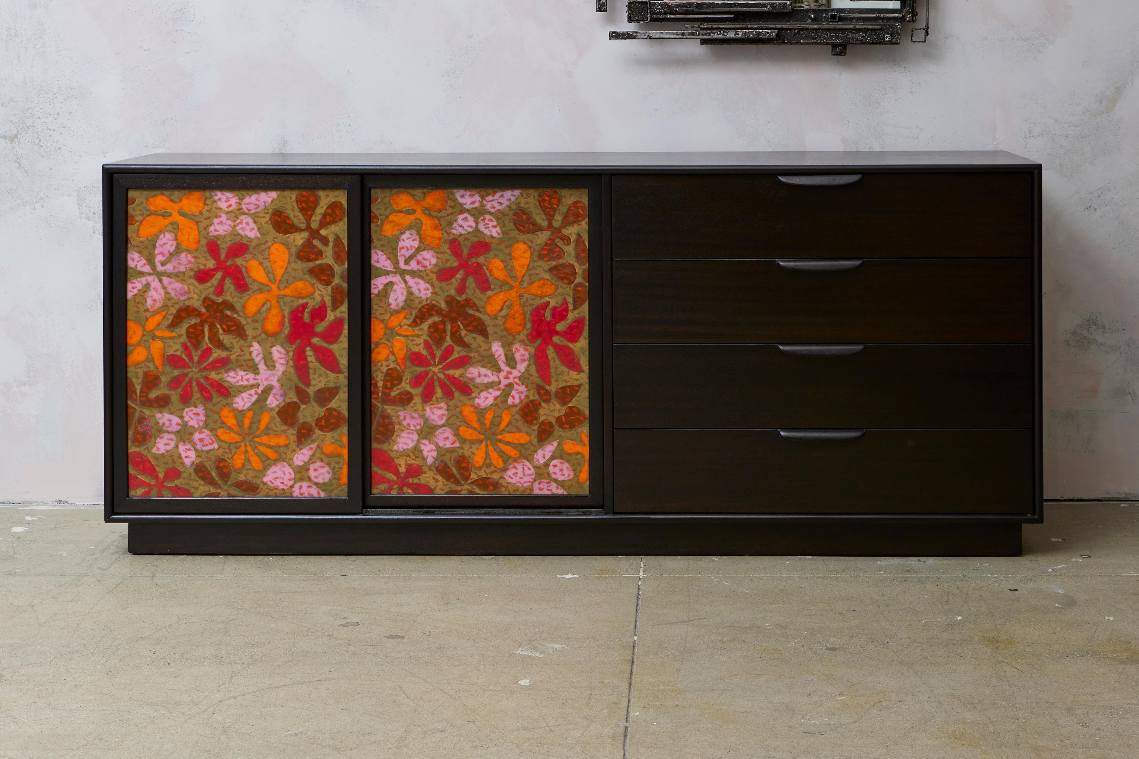 Harvey Probber Sideboard interior fitted with banks of enameled sliding shelves and drawers. Sliding fire-enameled copper doors and exterior drawers. This cabinet is newly refinished on the exterior only. The enameled shelves and drawers in
