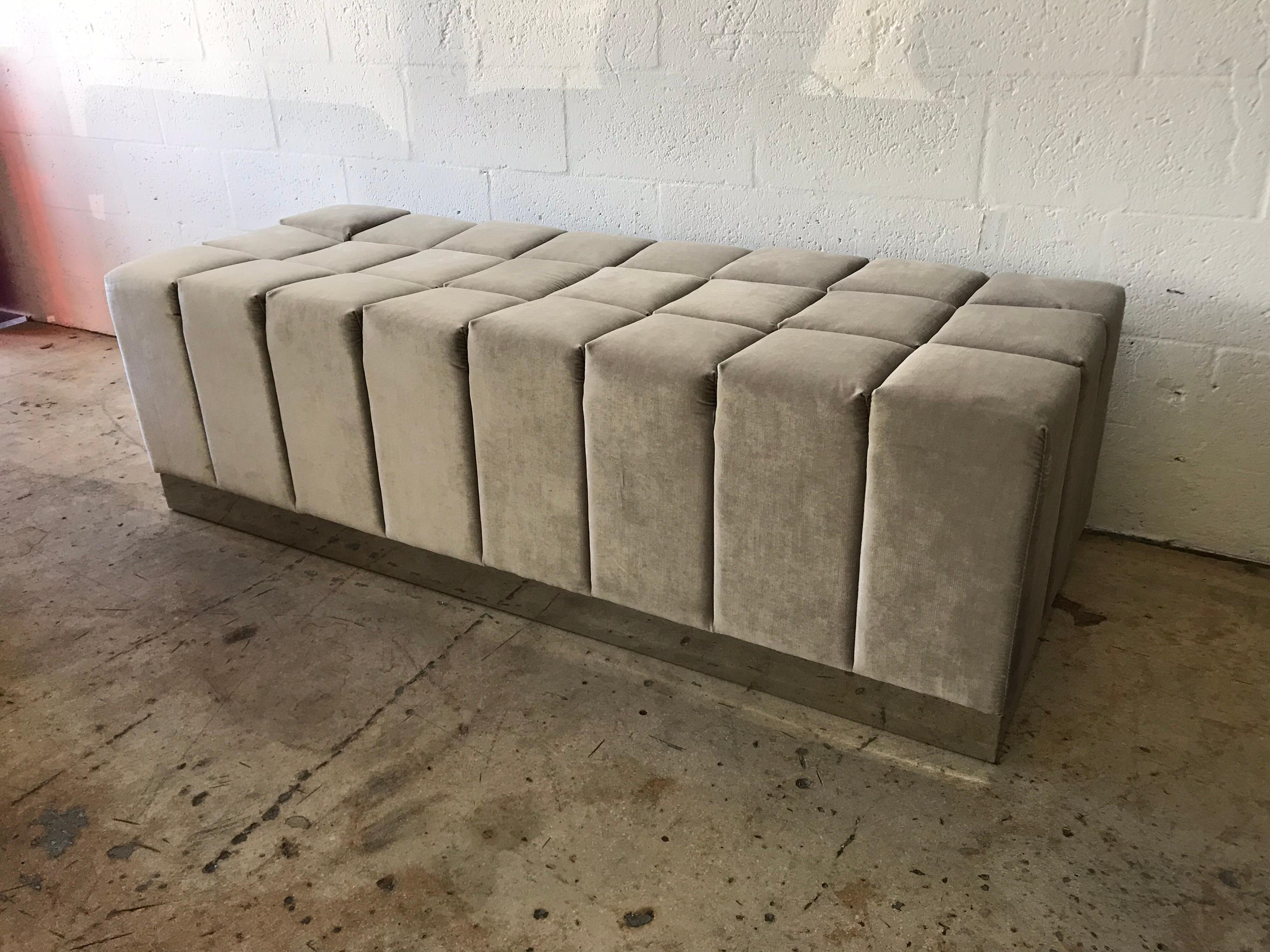 Biscuit tufted bench or ottoman stool rendered in grey, gray velvet and mirror polished stainless steel in the style of Harvey Probber