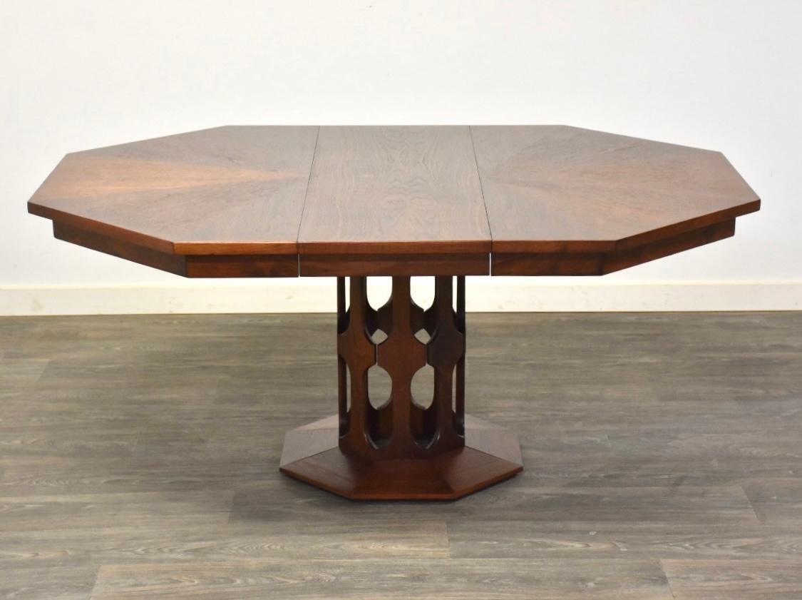 Gorgeous Mid-Century Modern cathedral style pedestal dining table with three leaves attrib to Harvey Probber.. The top is amazing with circle inlay and dynamite octagon shape, the three leaves are well matched to the original finish. . extra legs