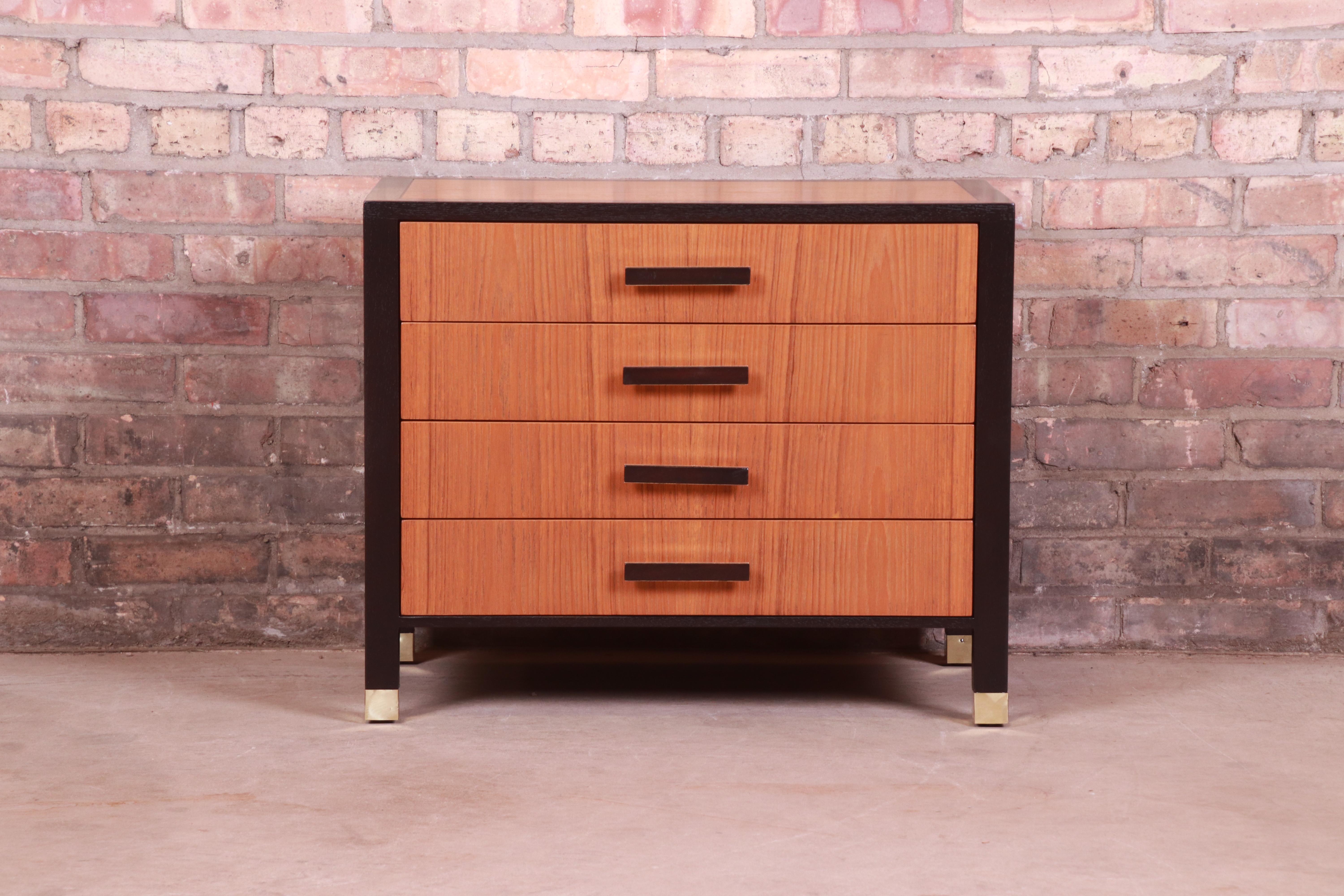 An exceptional Mid-Century Modern four-drawer nightstand or bachelor chest

By Harvey Probber

USA, 1960s

Teak, with ebonized mahogany banding, original mahogany and brass hardware, and brass-capped feet.

Measures: 26