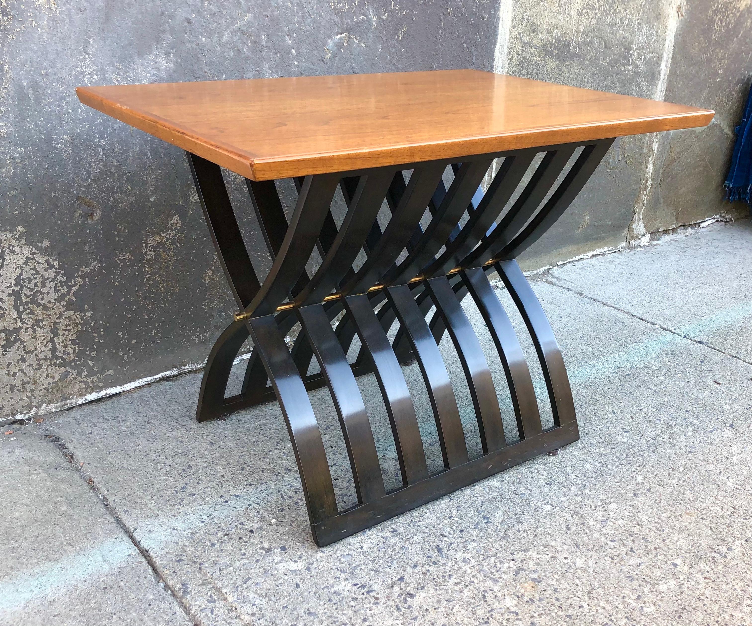 American, the rectangular teak top on dark stained mahogany curved slat X-base, with brass pin hardware, circa 1960. Model 1216 in the Harvey Probber catalog.