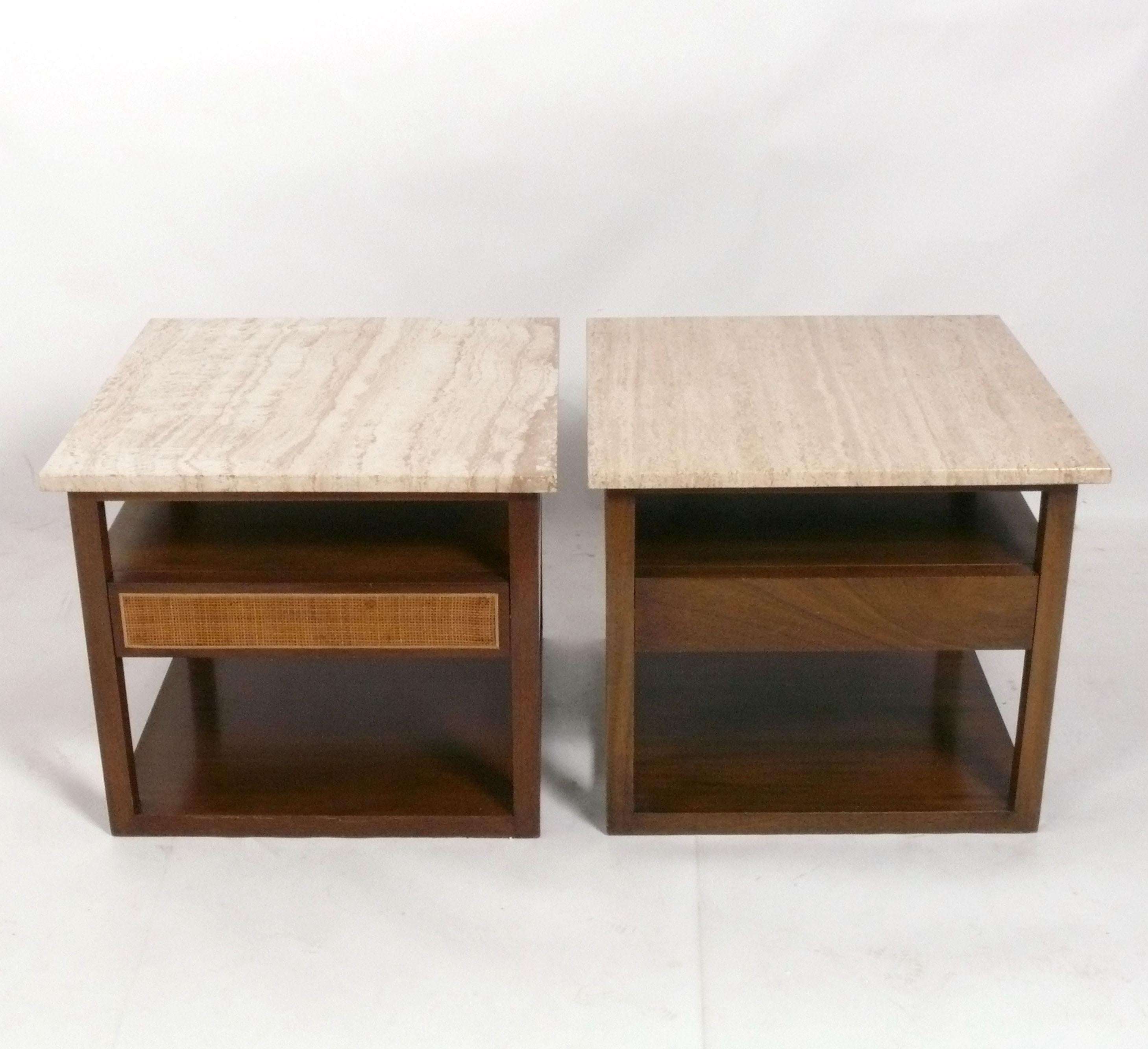 Mid Century Travertine and Mahogany Nightstands or End Tables, designed by Harvey Probber, American, circa 1960s. These came out of the same location, but they are not exactly a matched pair, as one has a reeded drawer front and the other does not.
