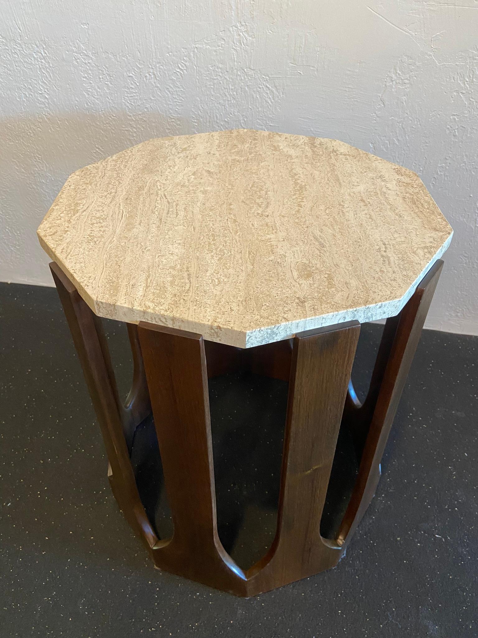 Harvey Probber travertine occasional table. Base constructed of mahogany. Table has been refinished and shows minimal signs of wear (please refer to photos). Mismatched mate to this table available in separate listing.

Would work well in a