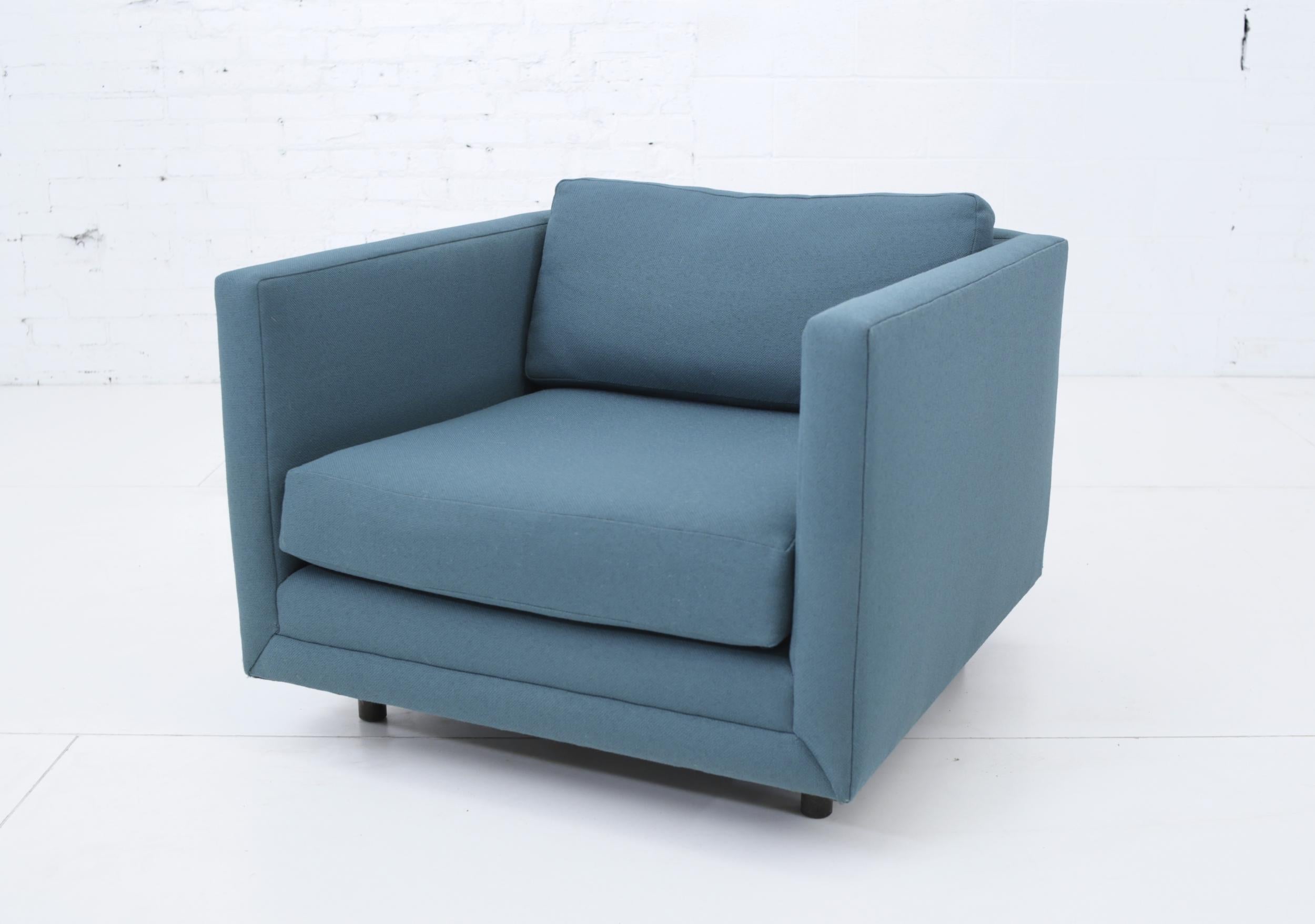 Tuxedo club chair by Harvey Probber. Reupholstered in teal fabric in the 1990s, which is in good condition.

 