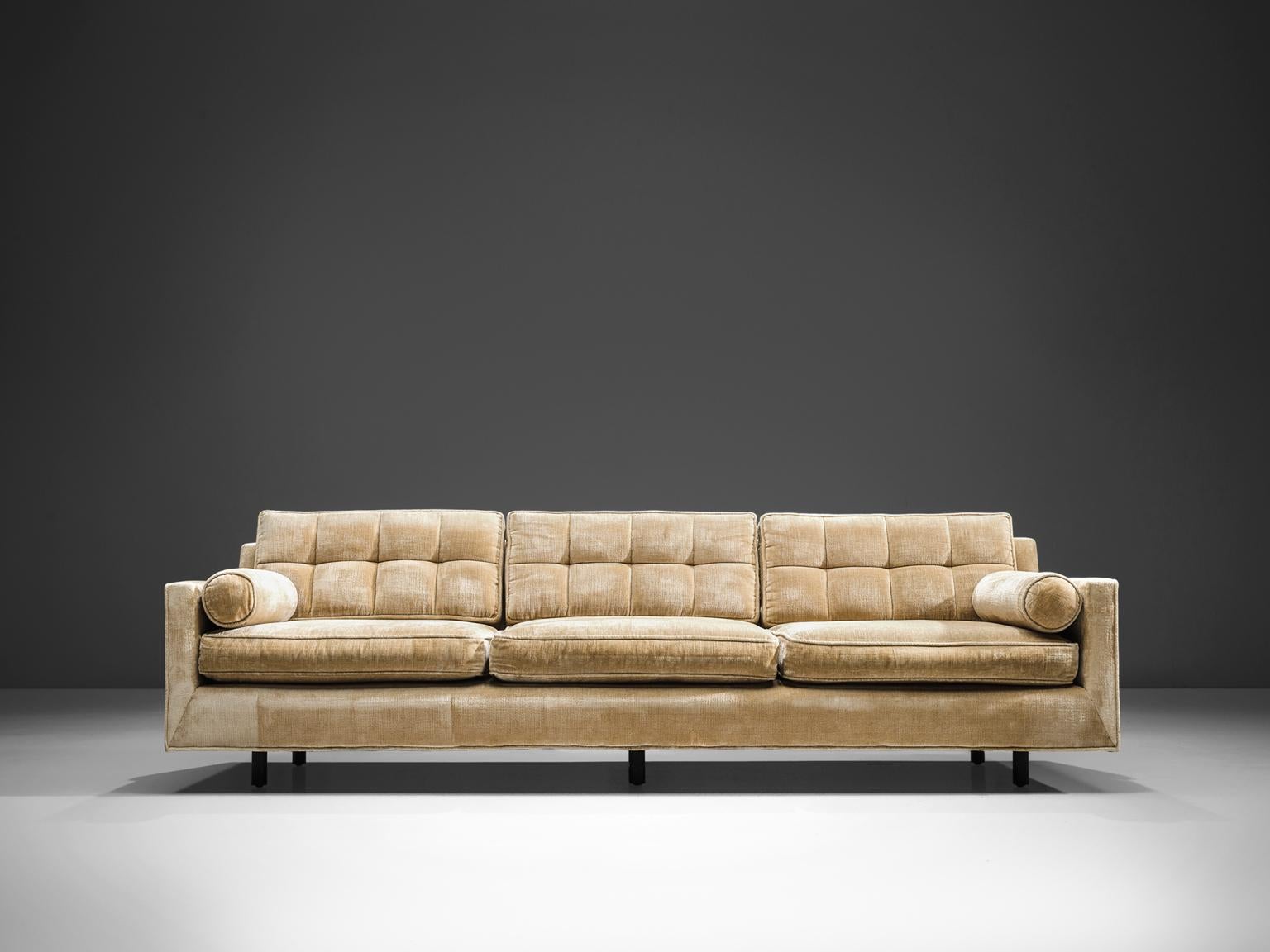 Harvey Probber, sofa, champagne to beige colored velvet, United States, 1950s. 

The style of the sofa is simple and elegant as it bears features of classic design combined with minimalist, sober influences. The comfortable three-seat sofa with