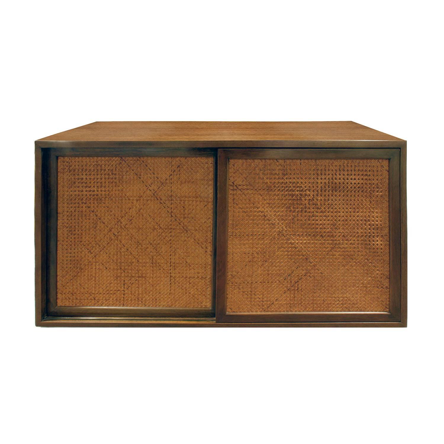 Wall mounted cabinet in mahogany with caned doors by Harvey Probber, American, 1950s.