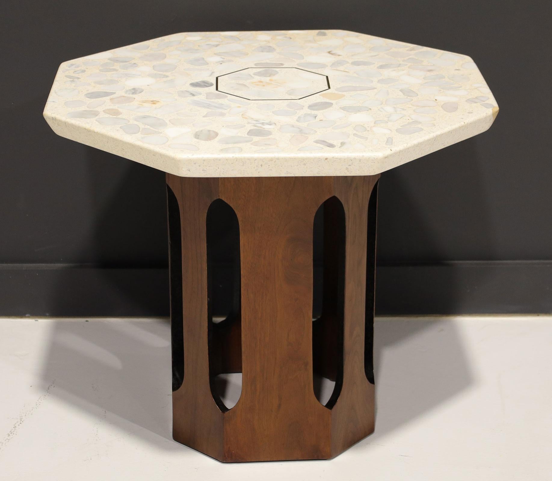 An iconic side table by Harvey Probber. A thick terrazzo top with a brass inlay on a walnut base. We have restored the base and polished the terrazzo.