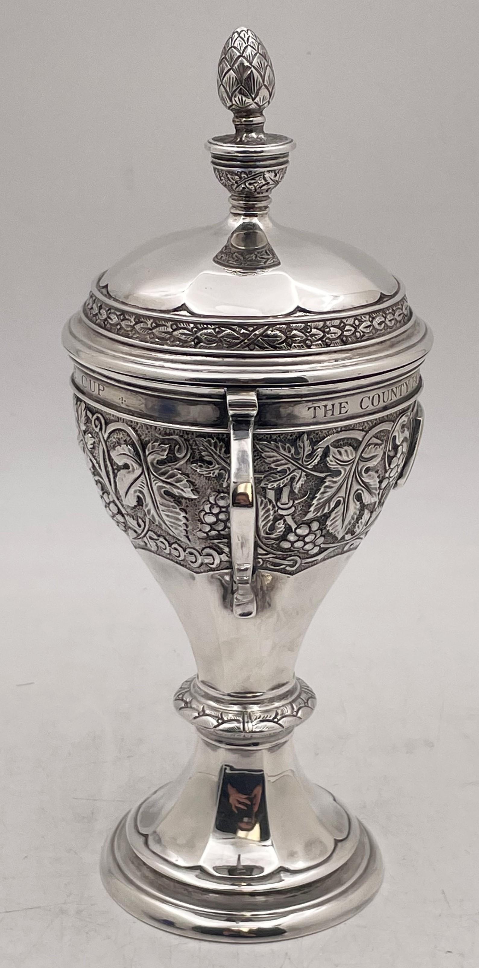 William Hair Haseler sterling silver, two-handled trophy cup, made in Birmingham, England, in 1933, specially commissioned for the 1934 Bournemouth Municipal Golf Tournament for Ladies, beautifully adorned with friezes, including a vine frieze, with