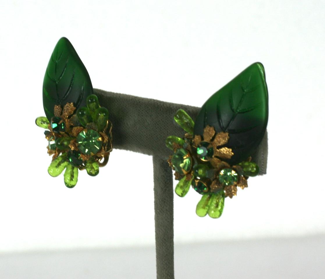 Haskell Style Glass Leaf Earrings with pate de verre teardrops and pastes set onto filigreed base around a molded green glass leaf.  Made in the style of Miriam Haskell but likely made by Robert NY. 
Clip back fittings.  1930's USA.
Excellent