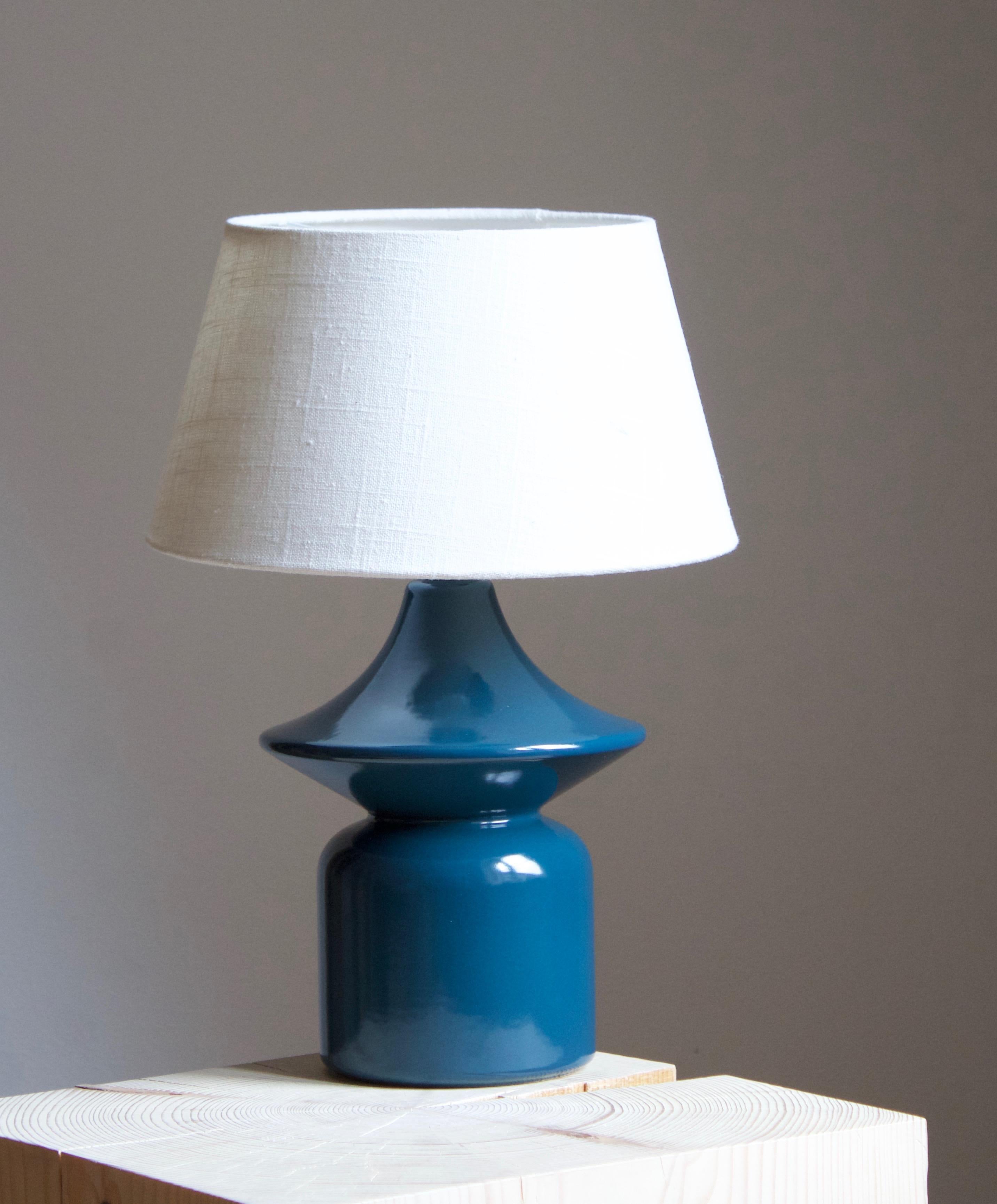 A table lamp produced by Hasle Keramik. In stoneware. Marked.

Stated dimensions exclude lampshade. Height includes socket. Sold without lampshade.

Glaze feature a blue color.

Other ceramicists of the period include Axel Salto, Arne Bang,