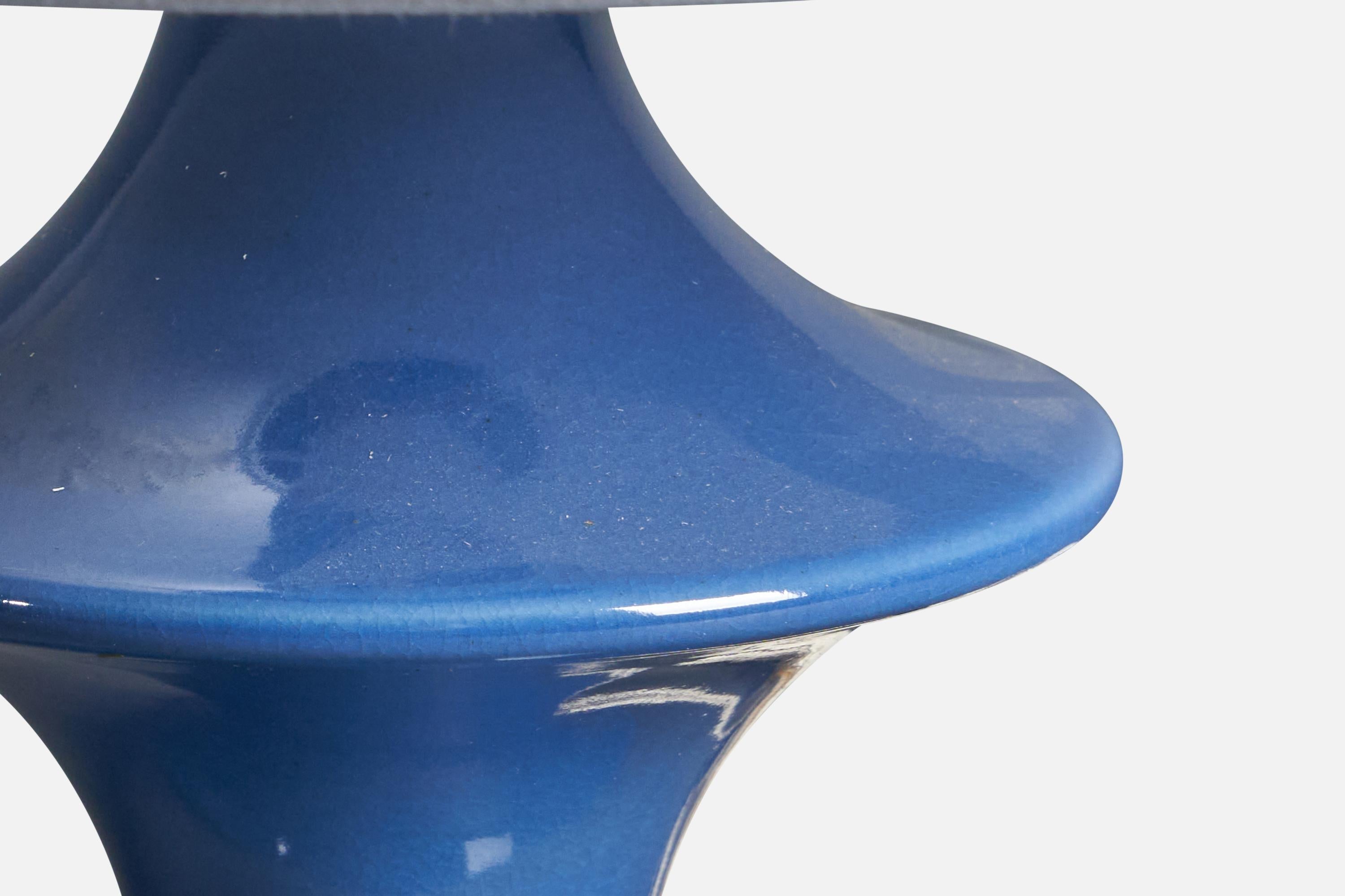 A blue-glazed stoneware table lamp designed and produced by Hasle Keramik, Bornholm, Denmark, 1960s.

Dimensions of Lamp (inches): 9.25