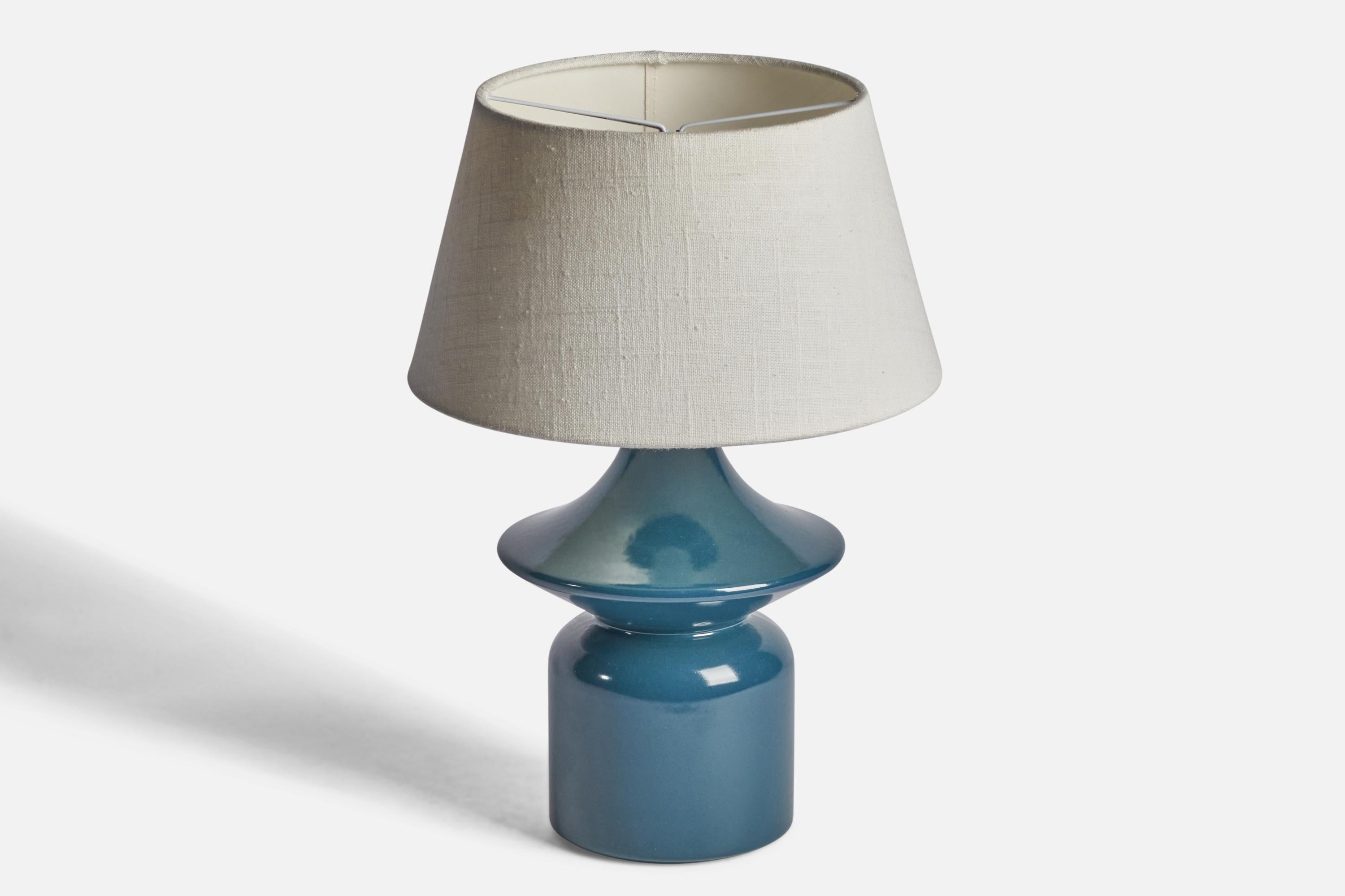 A blue-glazed stoneware table lamp designed and produced by Hasle Keramik, Bornholm, Denmark, 1960s.

Dimensions of Lamp (inches): 11.5